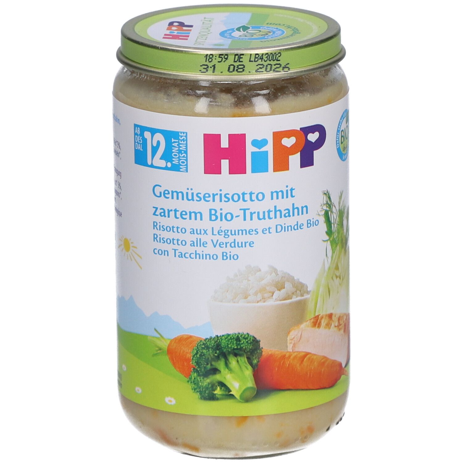 Bocal HiPP avec risotto. Étiquette avec ingrédients, logo et illustrations. Couvercle vert avec date limite.