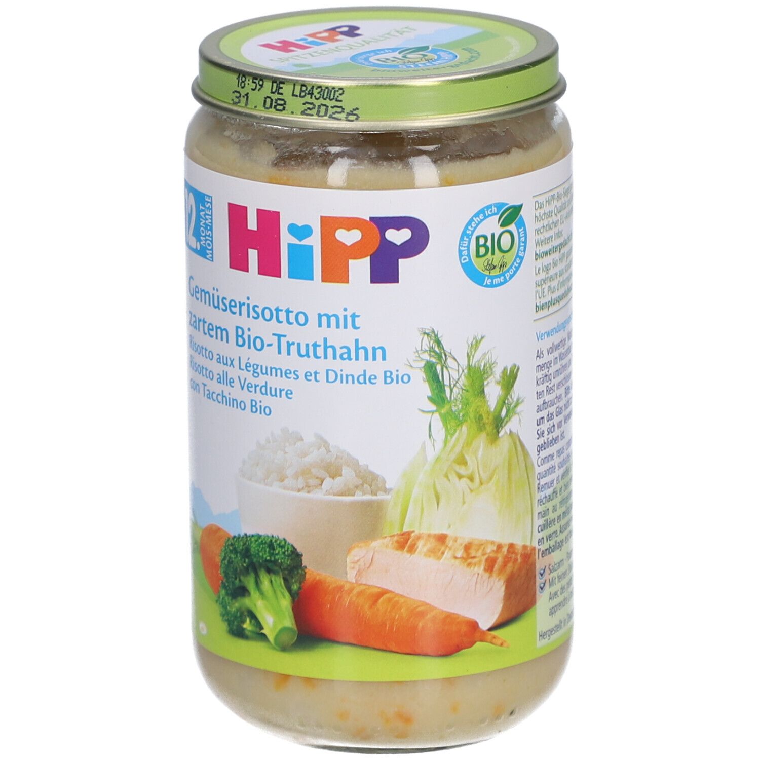 Bocal HiPP avec risotto. Étiquette avec ingrédients, logo et illustrations. Couvercle vert avec date limite.