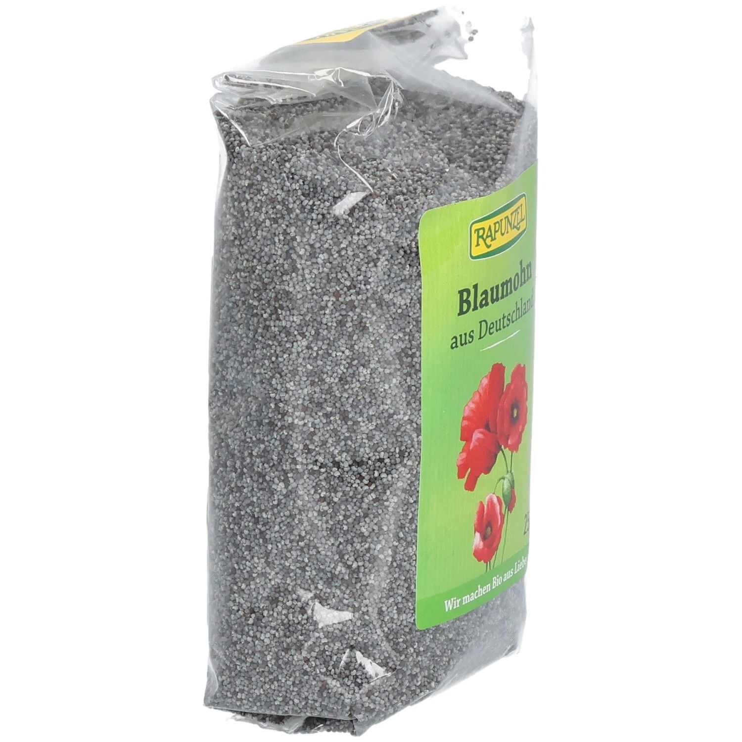 Verpackung mit Blaumohn, leicht schräg. Grünes Etikett mit "RAPUNZEL", "Blaumohn aus Deutschland", Mohnblumen und Text.