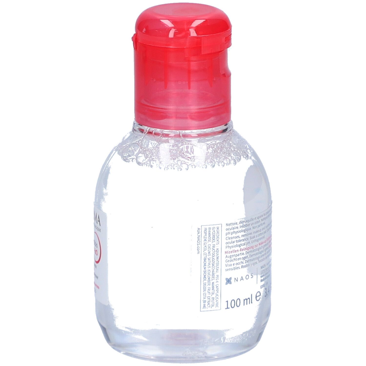 Flacon transparent, bouchon rouge. Étiquette avec texte et 100 ml. Eau micellaire démaquillante.