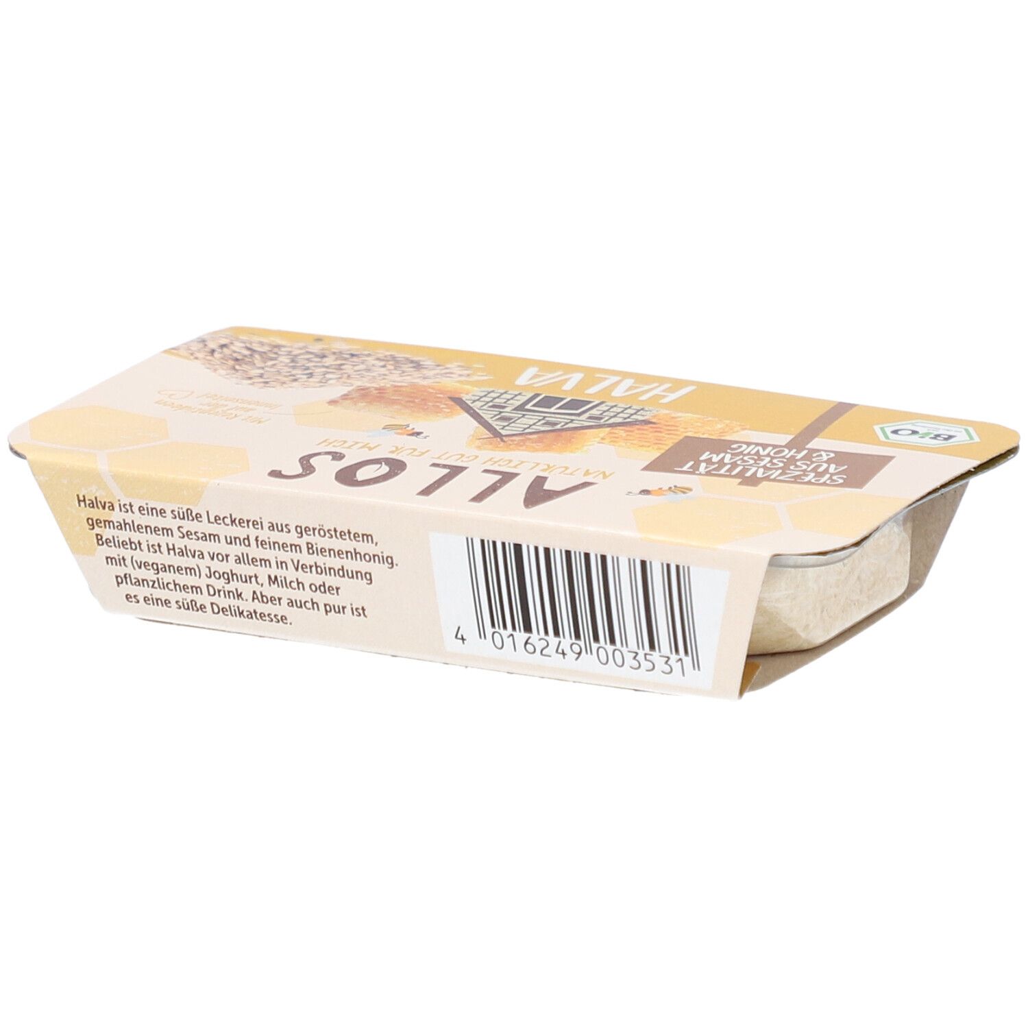 Halva-Verpackung. Gelbe Verpackung mit Aufschrift "Spezialität aus Sesam & Honig". Bio-Siegel. Text.