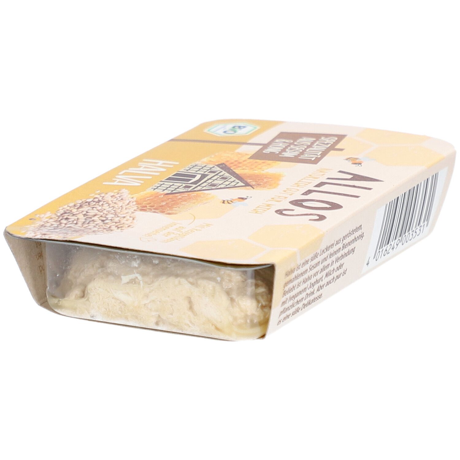 Halva-Verpackung. Gelbe Verpackung mit Aufschrift "Spezialität aus Sesam & Honig". Bio-Siegel.