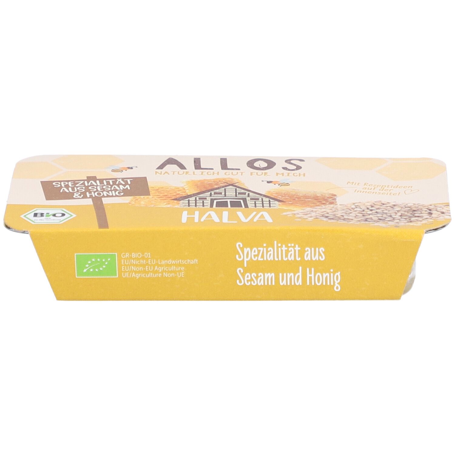 Halva-Verpackung. Gelbe Verpackung mit Aufschrift "Spezialität aus Sesam & Honig". Bio-Siegel.