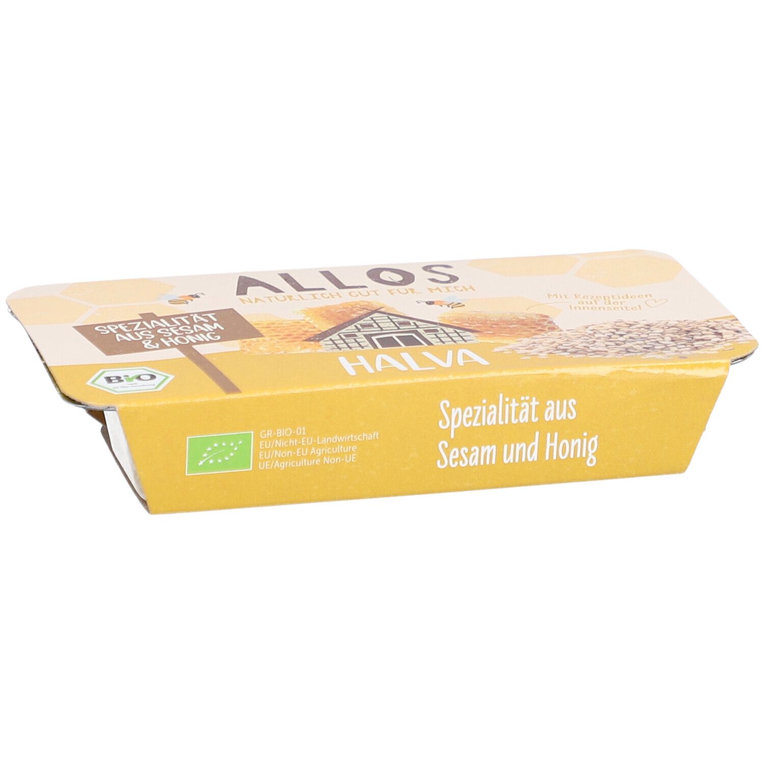 Halva-Verpackung. Gelbe Verpackung mit Aufschrift "Spezialität aus Sesam & Honig". Bio-Siegel.