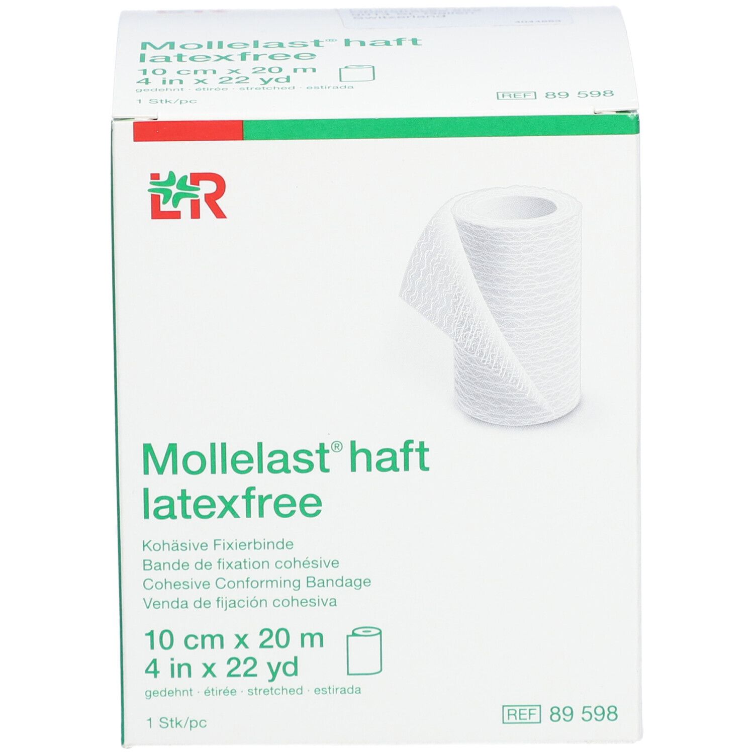 Emballage blanc avec bande de fixation roulée. Inscription : Mollelast haft latexfree, 10 cm x 20 m, 1 pc.