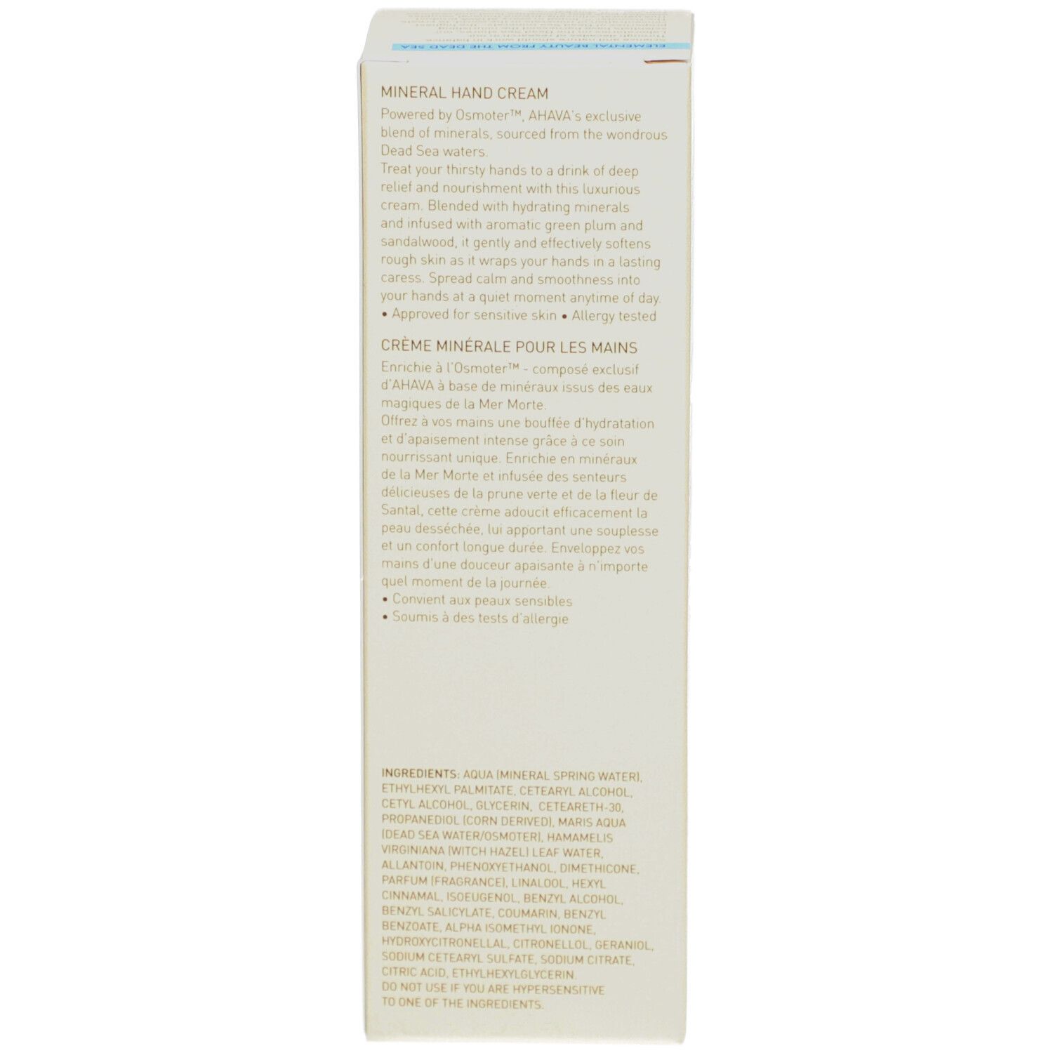 Côté de l'emballage de la crème pour les mains AHAVA. Texte multilingue. Fond beige. Ingrédients.