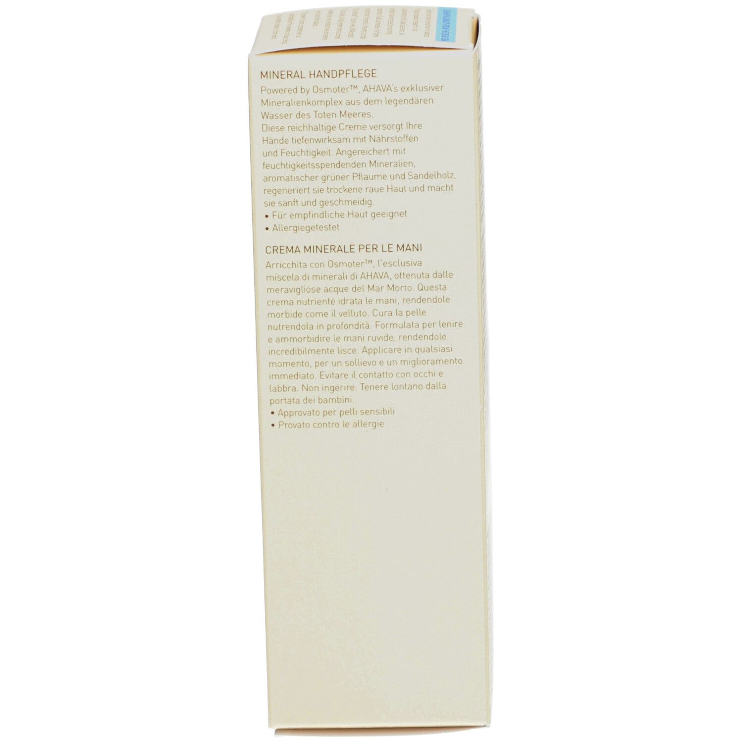 Côté de l'emballage de la crème pour les mains AHAVA. Texte multilingue. Fond beige. Informations.