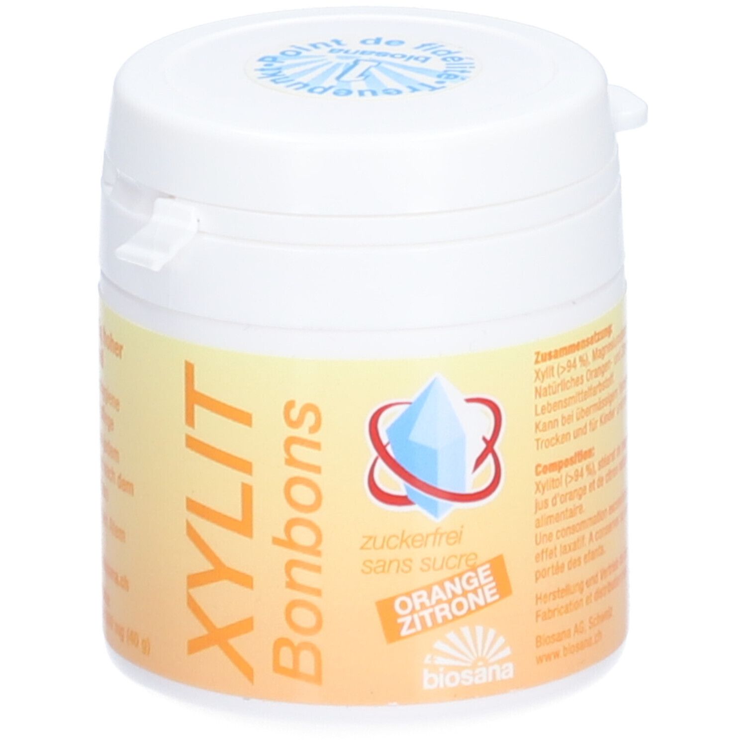 Witte pot met deksel. Opschrift: XYLIT Bonbons, suikervrij, Sinaasappel Citroen. Logo met blauw kristal.