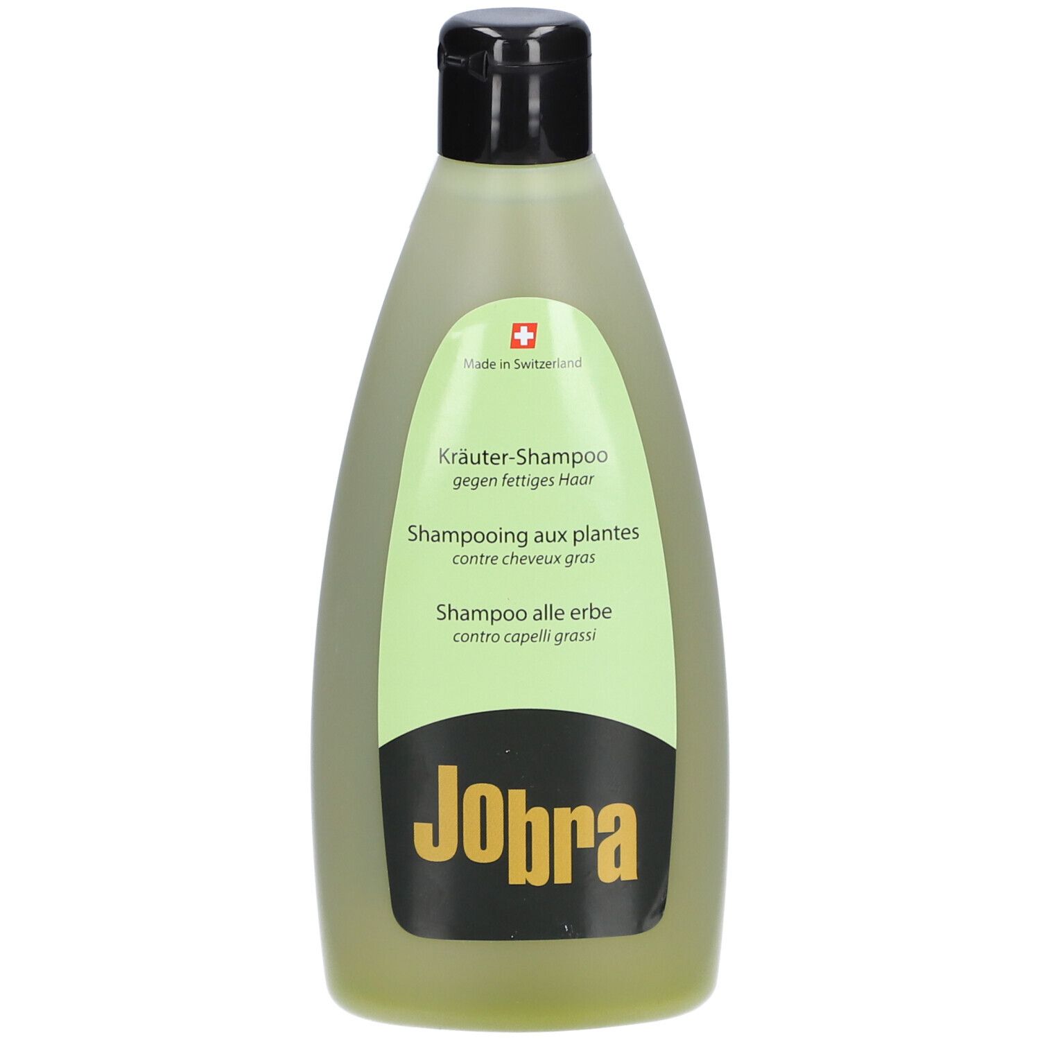 Grüne Flasche mit schwarzem Deckel. Etikett mit Text: Kräuter-Shampoo, Shampooing aux plantes, Shampoo alle erbe. Marke: Jobra.