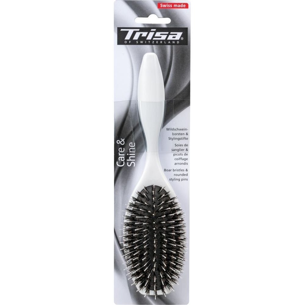 Haarbürste mit weißem Griff und Borsten, in Verpackung. "Care & Shine" und "Swiss made" sichtbar.