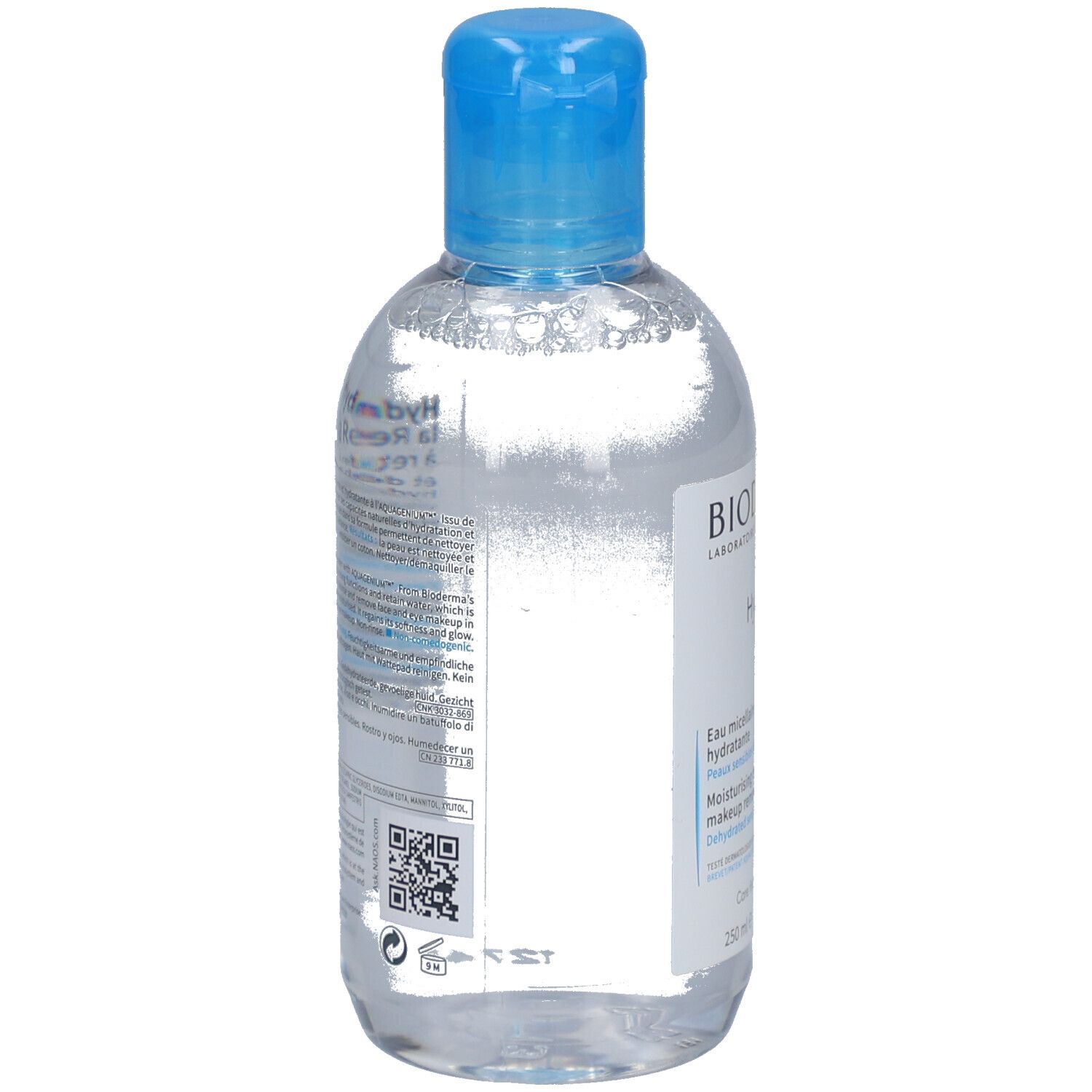 Rückseite der Flasche. Text in mehreren Sprachen. QR-Code und Barcode. Flasche mit blauem Deckel.