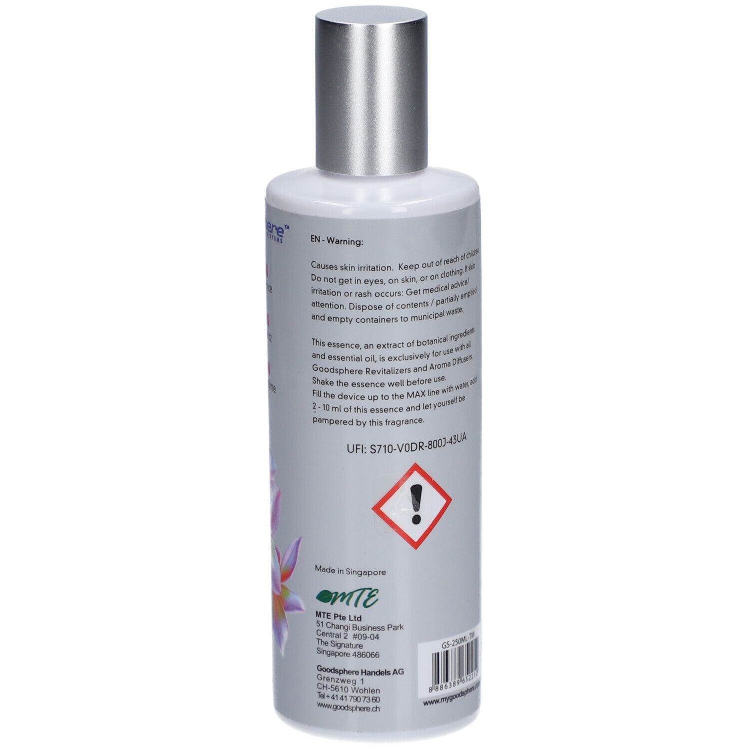Rückseite der grauen Flasche mit silbernem Deckel. Text in mehreren Sprachen. Gefahrensymbol.