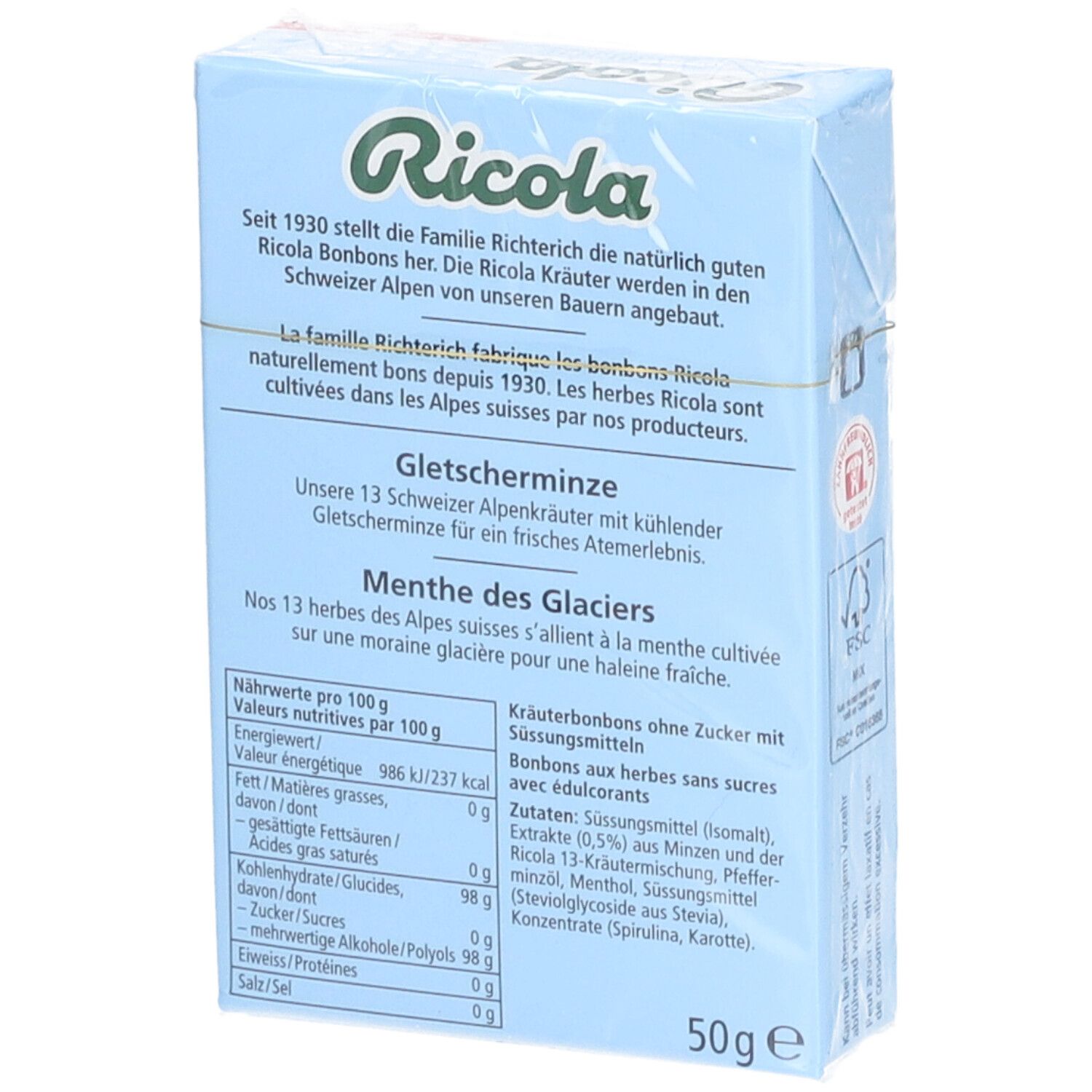 Rückseite der hellblauen Ricola-Schachtel. Text über die Herstellung und Inhaltsstoffe der Bonbons.