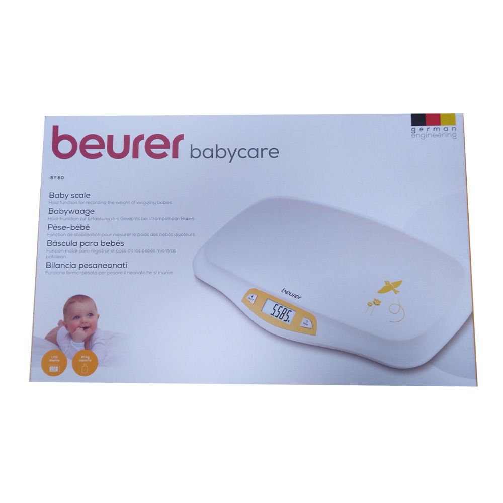 Babywaage in Verpackung. Weiß, mit digitaler Anzeige. Marke: Beurer babycare. Deutsche Flagge.