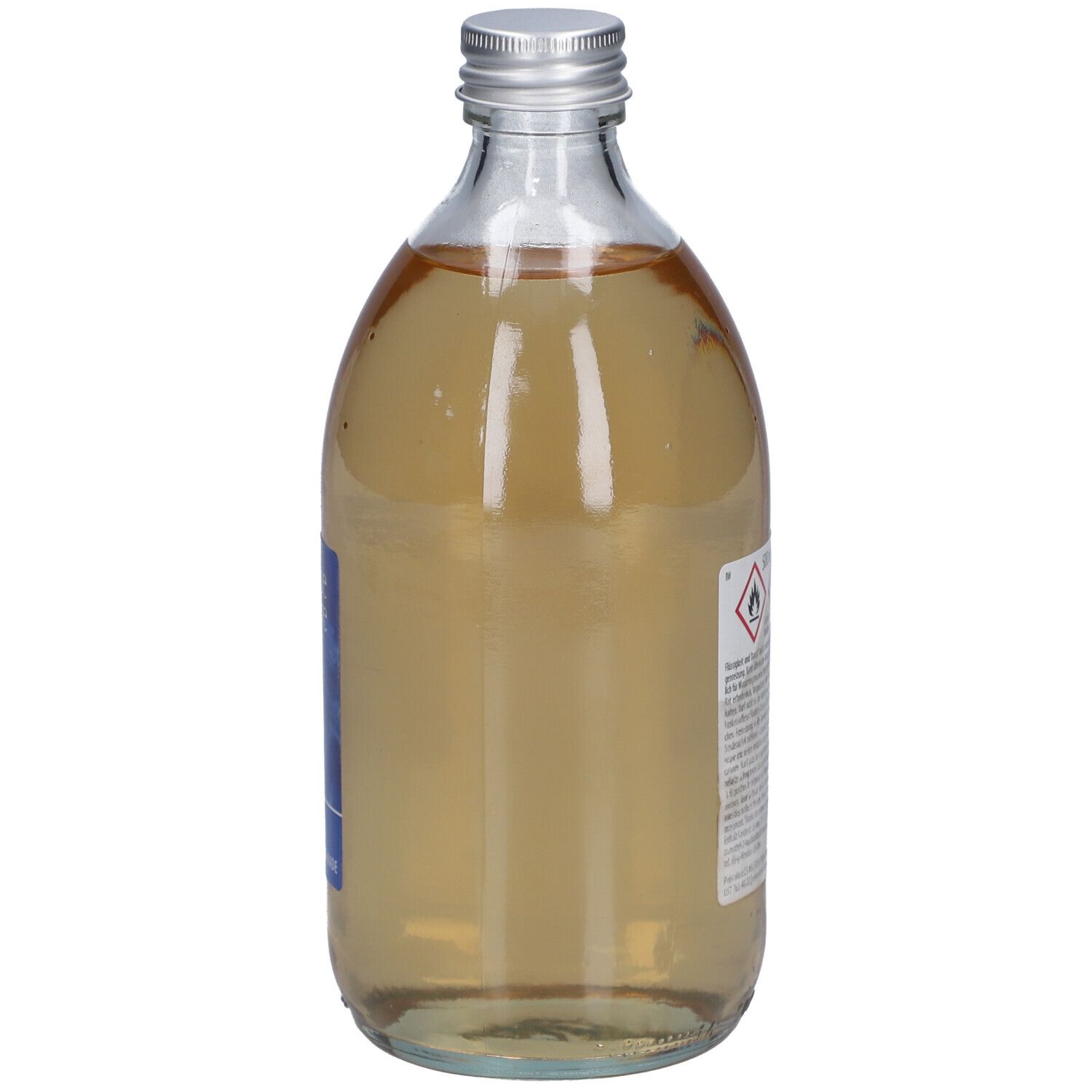 Glasflasche mit silbernem Deckel. Rückseite mit Etikett und Warnhinweisen. Flüssigkeit.