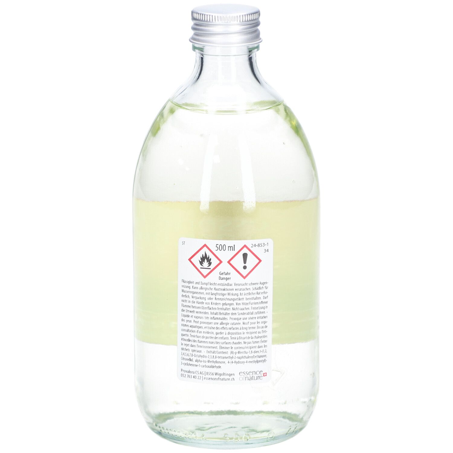 Flacon en verre avec liquide. Étiquette avec symboles d'avertissement, texte et indication de volume 500 ml. Bouchon métal.