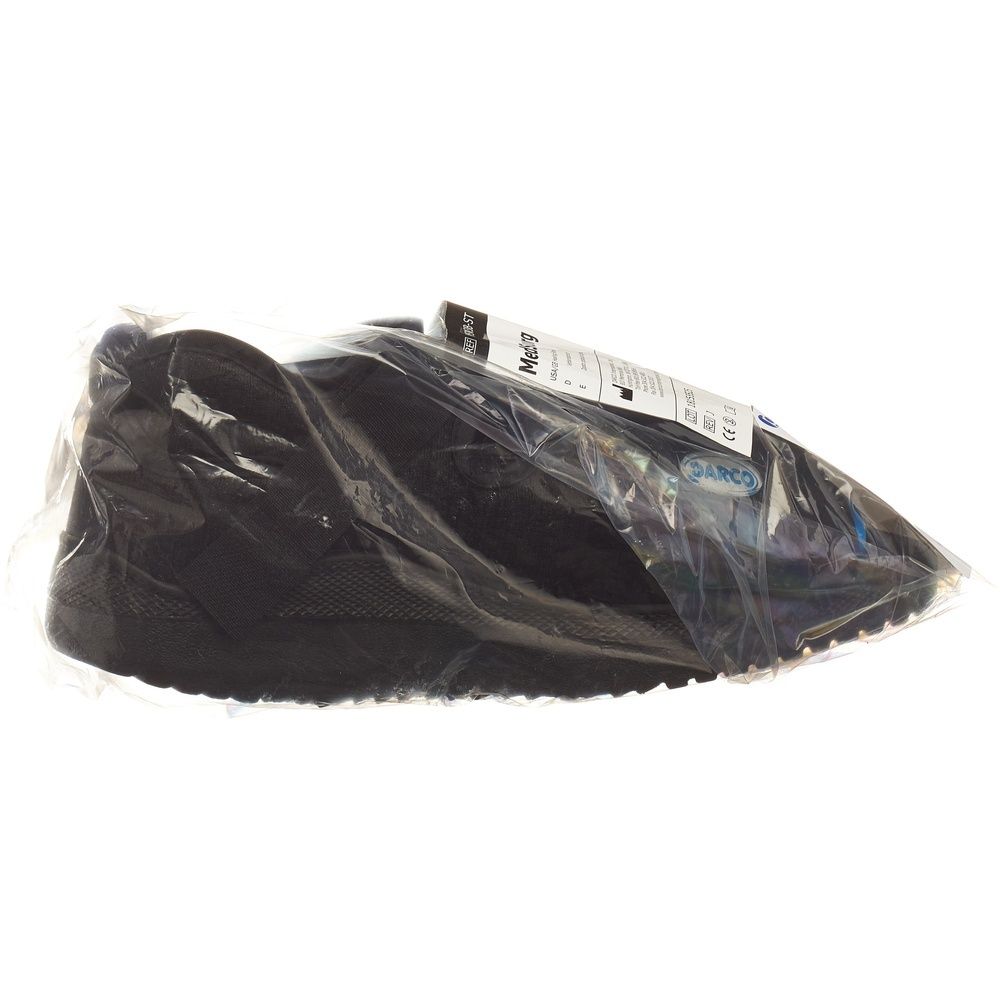Schwarzer Schuh in Plastikverpackung. Etikett mit Produktinformationen. Marke DARCO sichtbar.