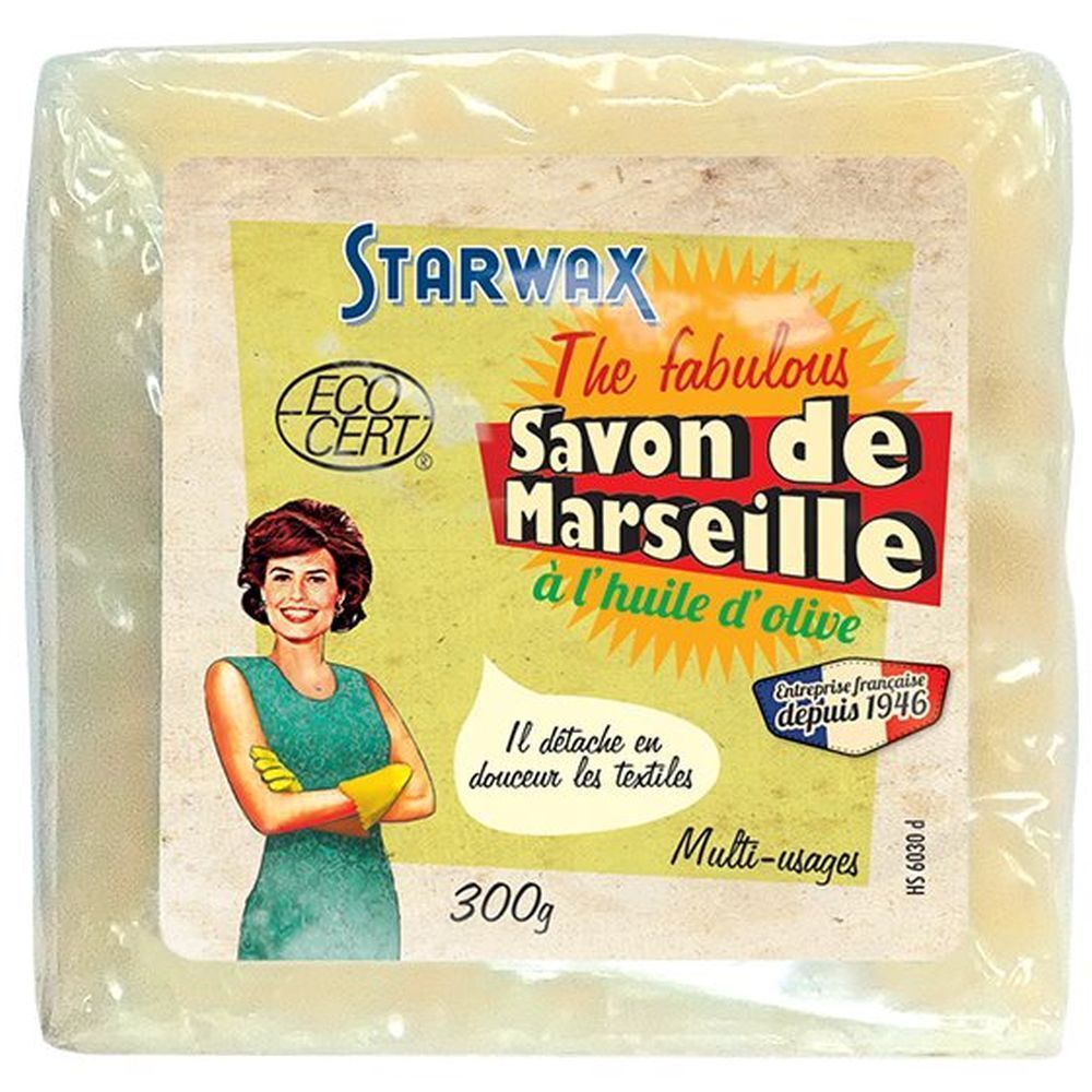 Quadratischer Seifenblock in Folie. Aufkleber mit Produktname, Frau, Logo und Text. "Savon de Marseille à l'huile d'olive".