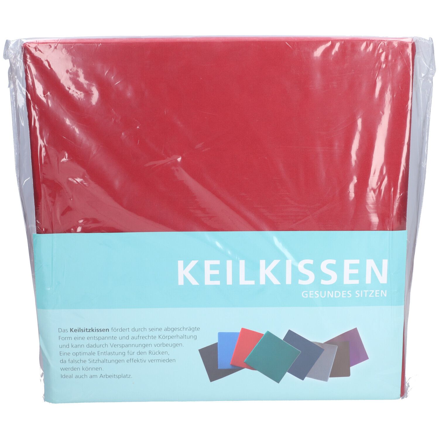 Rotes Keilkissen in Folienverpackung. Aufschrift: Keilkissen, Gesundes Sitzen. Farbige Kissen-Abbildungen.