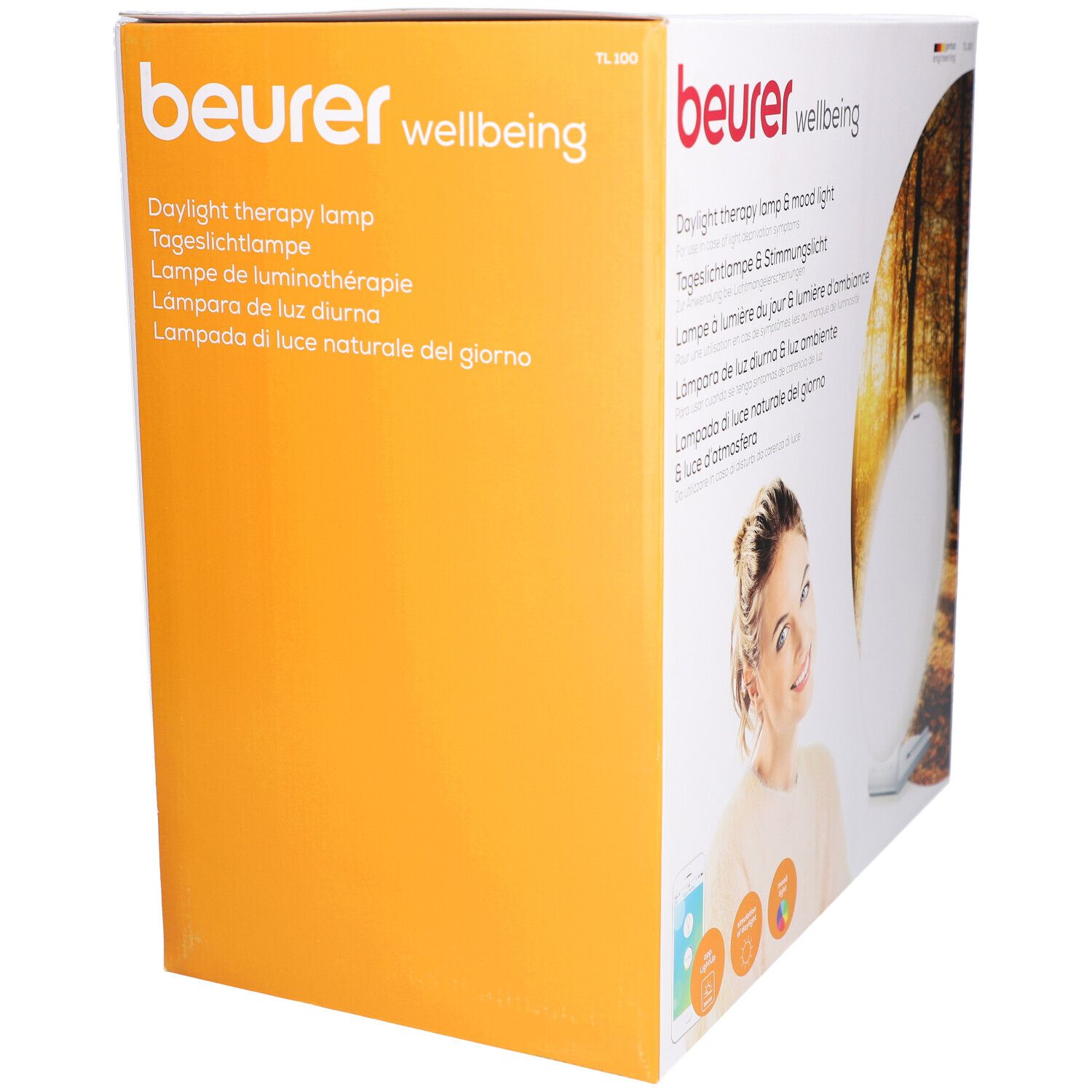 Beurer TL 100 Verpackung. Aufdruck: Tageslichtlampe & Stimmungslich. Produktabbildung. Orangefarbener Hintergrund.