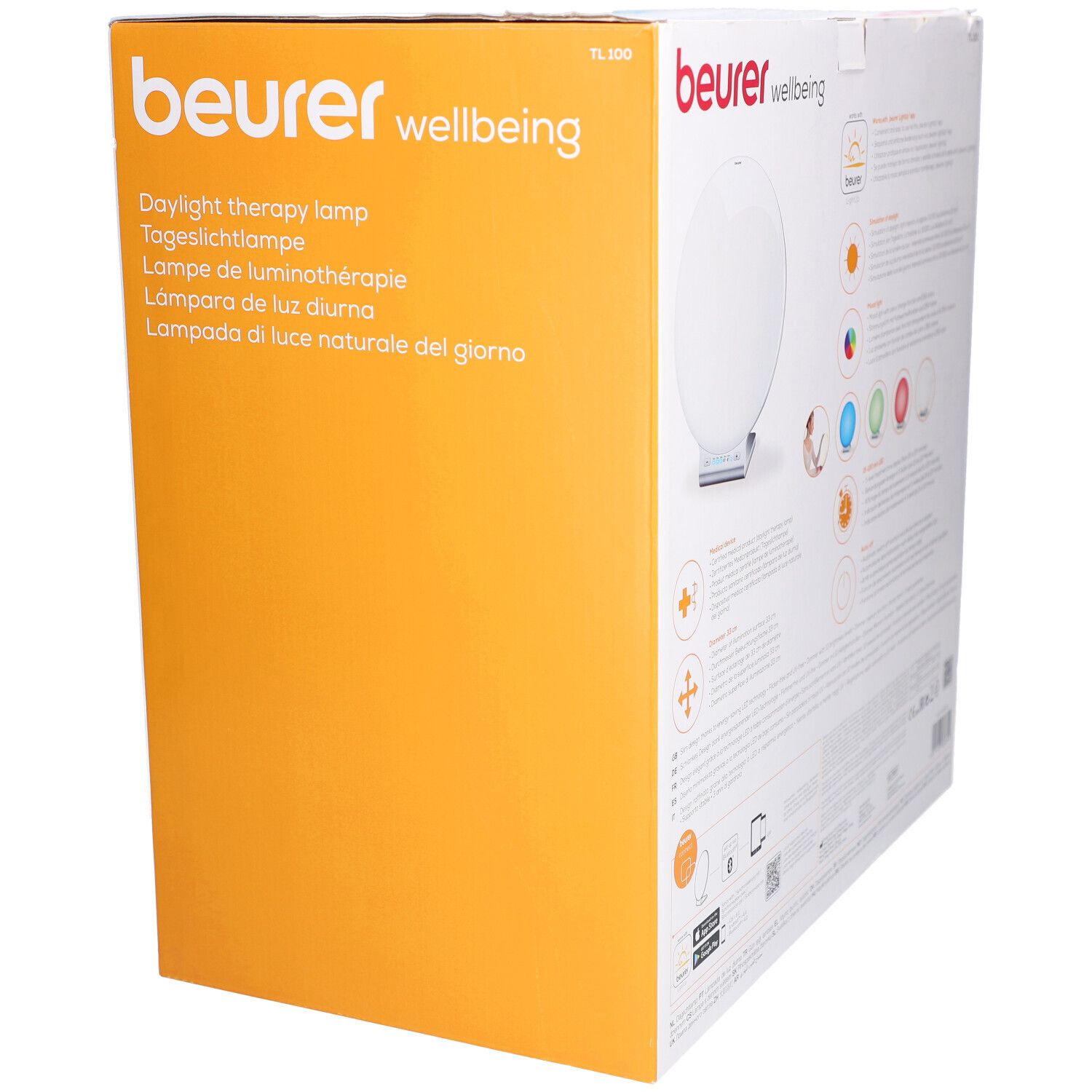 Beurer TL 100 Verpackung. Aufdruck: Tageslichtlampe & Stimmungslich. Produktabbildung. Orangefarbener Hintergrund.