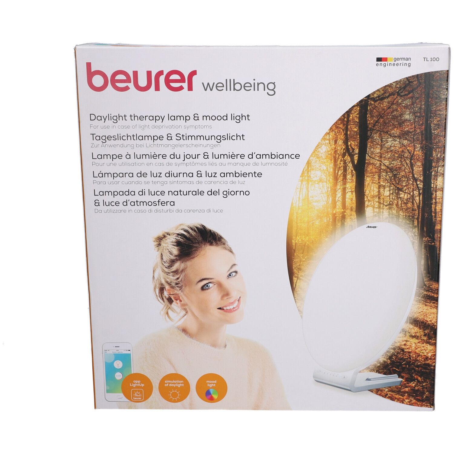 Beurer TL 100 Verpackung. Aufdruck: Tageslichtlampe & Stimmungslich. Frau mit Smartphone. Produktabbildung.