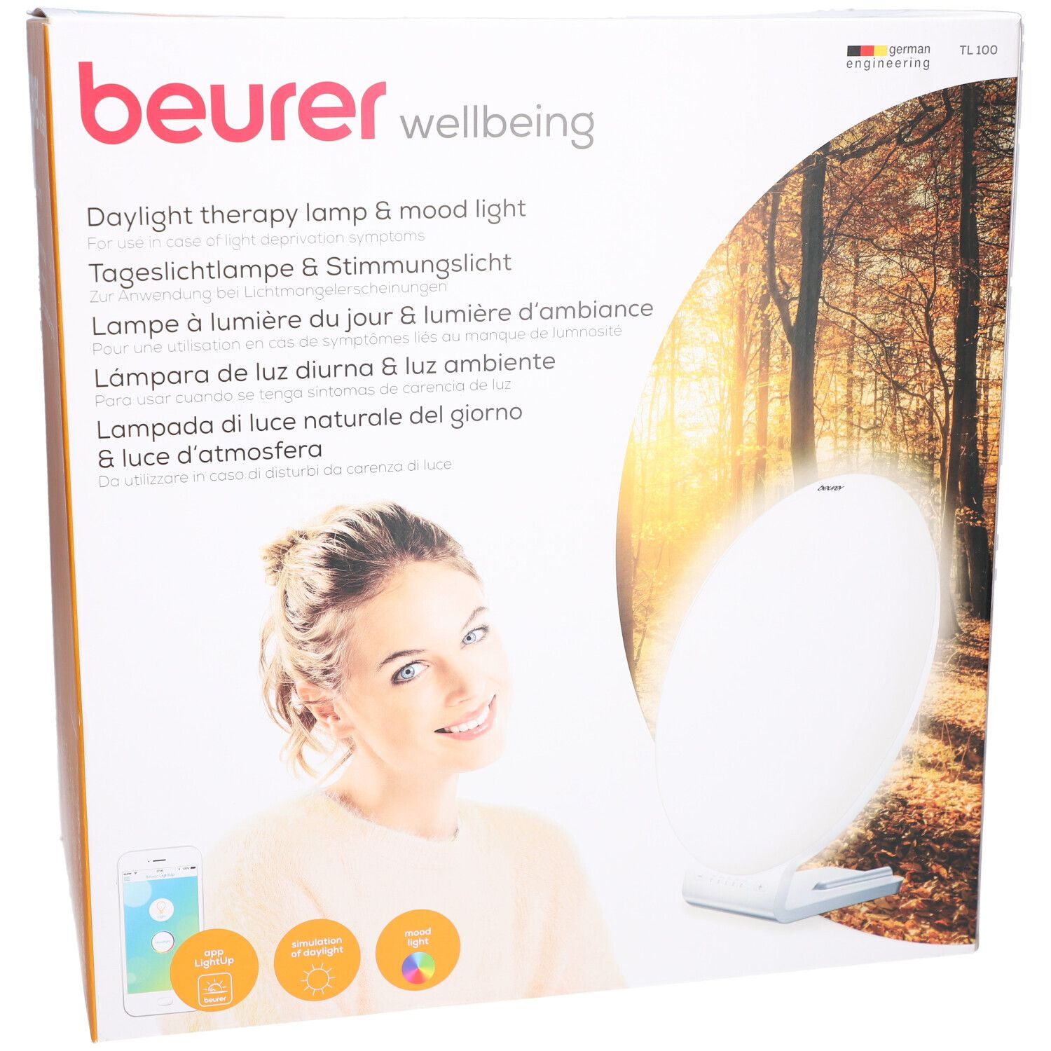 Beurer TL 100 Verpackung. Aufdruck: Tageslichtlampe & Stimmungslich. Frau mit Smartphone. Produktabbildung.