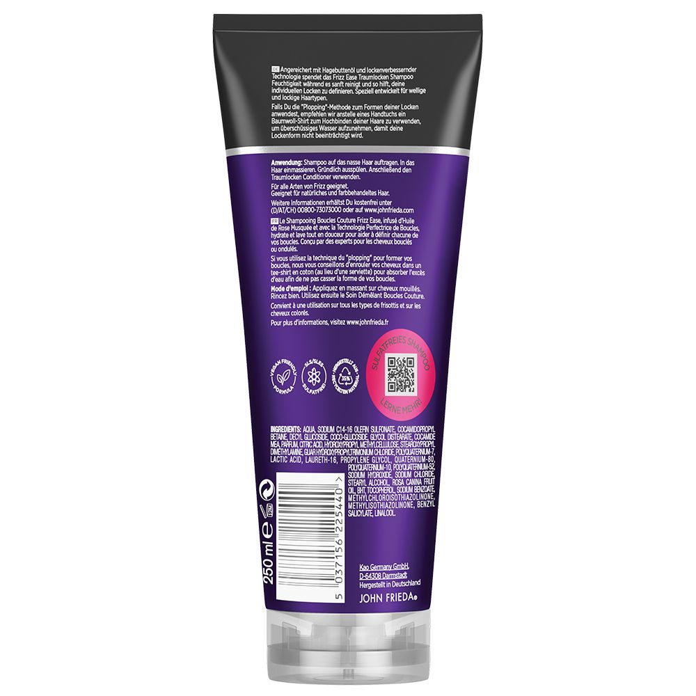 Rückseite der JOHN FRIEDA Frizz ease Traumlocken Shampoo Tube. Lila Hintergrund, Text und Logos. Enthält Inhaltsstoffe und QR-Code. Transparente Kappe.