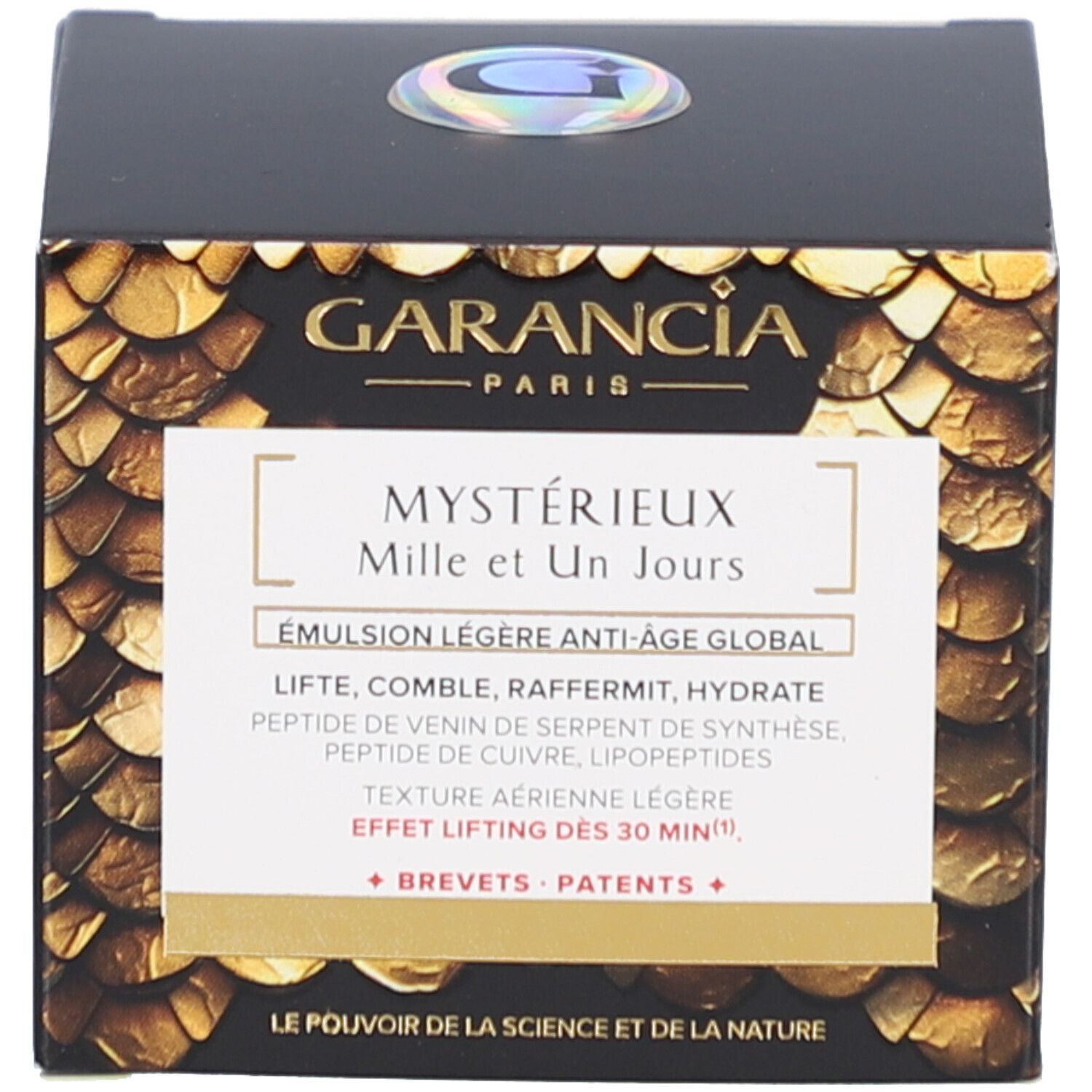 Schwarze Schachtel mit goldfarbenem Muster. Aufschrift: GARANCIA PARIS, Mystérieux Mille et Un Jours, Émulsion légère anti-âge global.