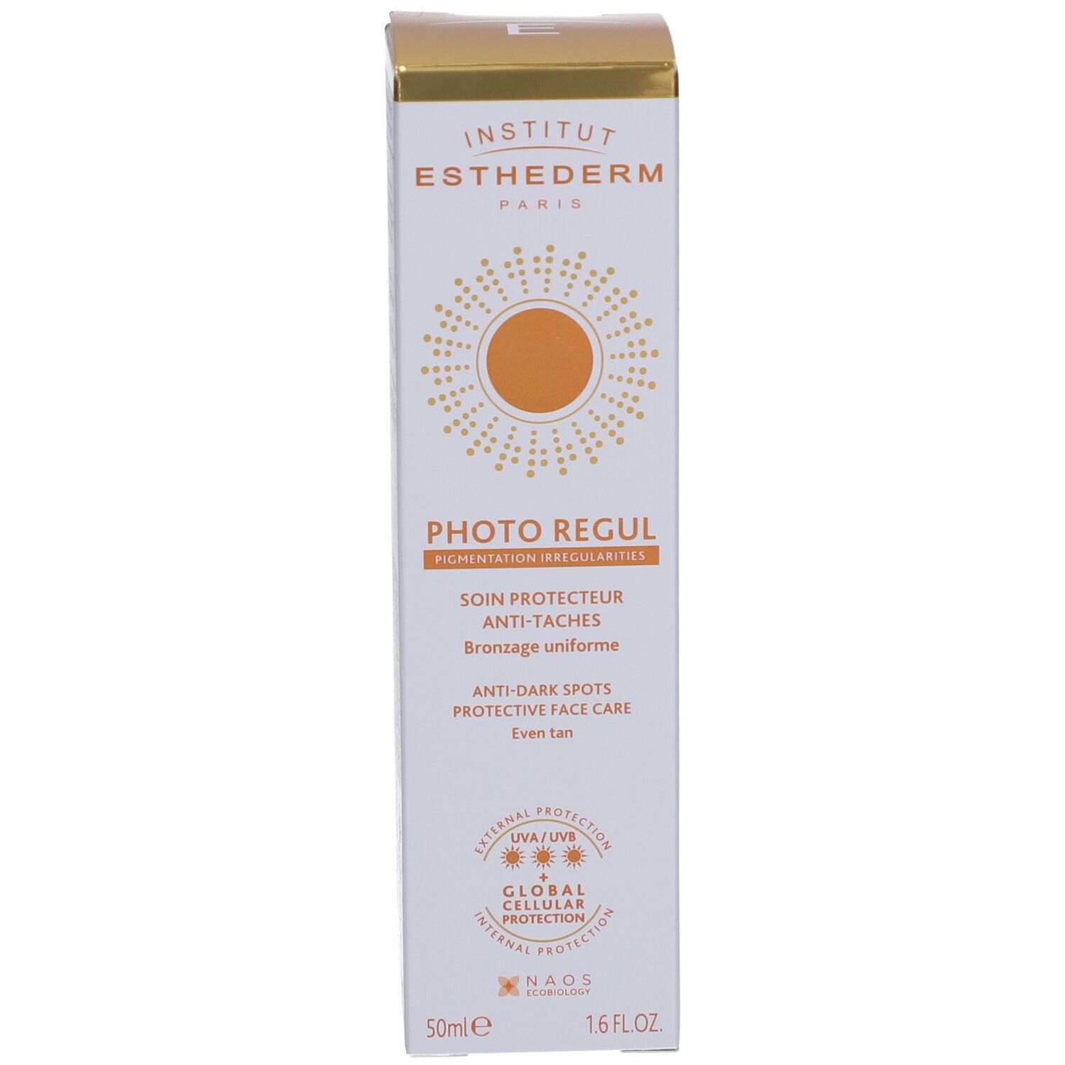 Schachtel mit Produktinformationen. Aufschrift: Photo Regul, Anti-Flecken-Pflege, SPF50+. Marke: Institut Esthederm. Goldfarbene Akzente.