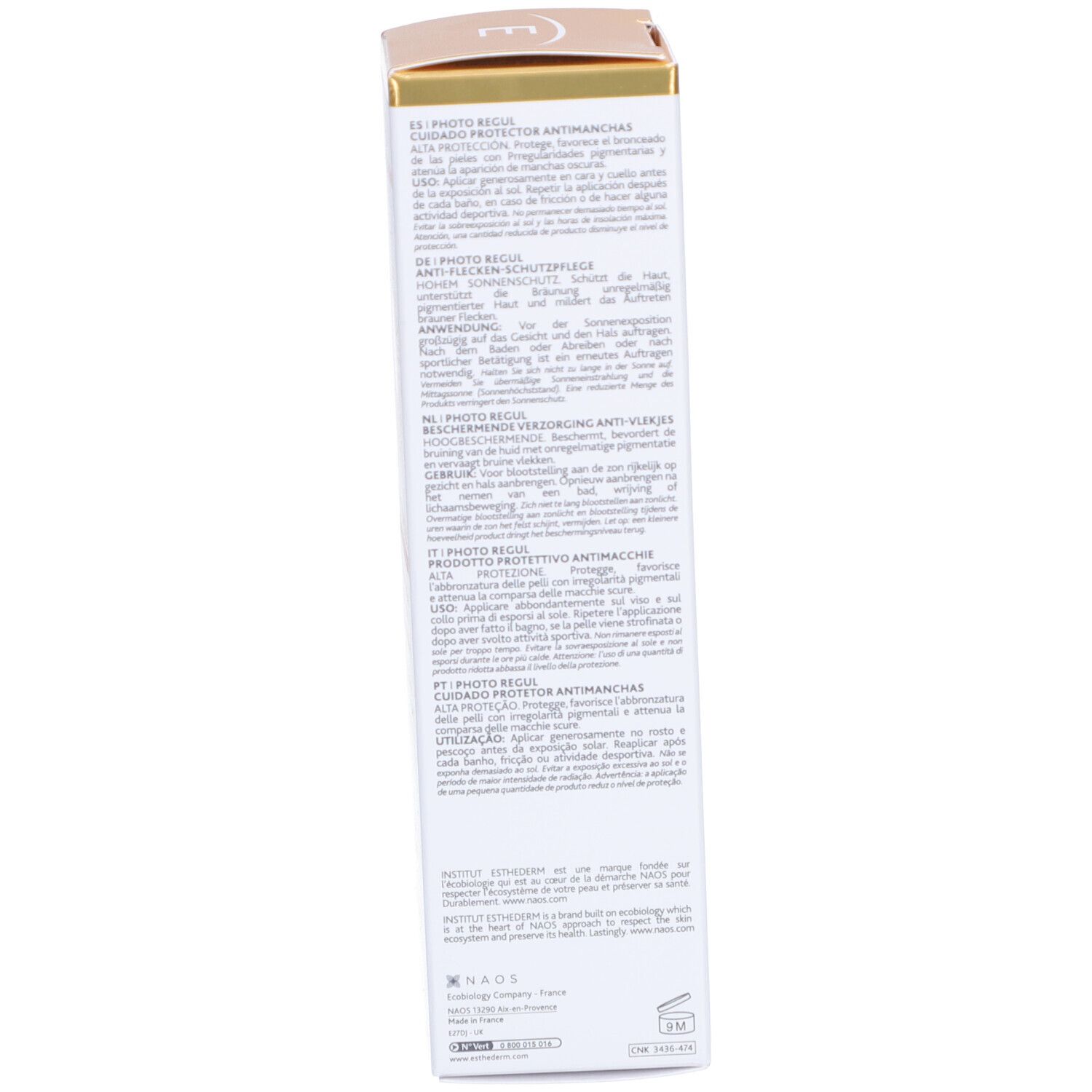 Seite der Schachtel. Text in mehreren Sprachen. Informationen zur Anwendung und Inhaltsstoffen. Goldfarbene Akzente.