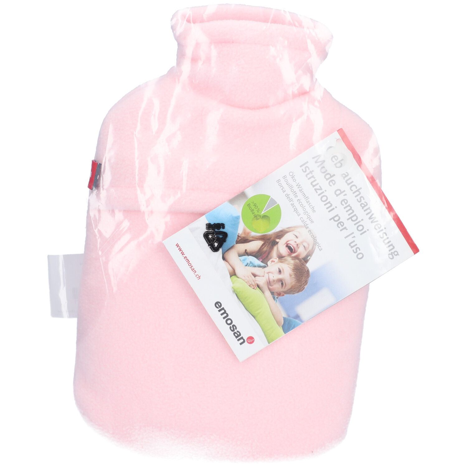 Bouillotte rose sous film plastique. Étiquette avec instructions d'emploi, marque Emosan. Illustration enfants. Certification.