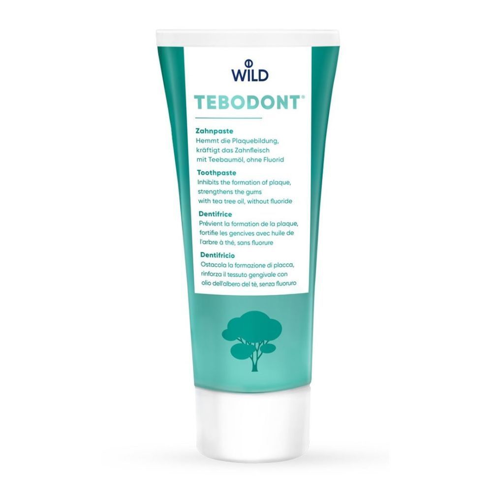 Groen-witte tandpastatube. Opschrift TEBODONT, productinformatie. Boom-symbool onderaan.