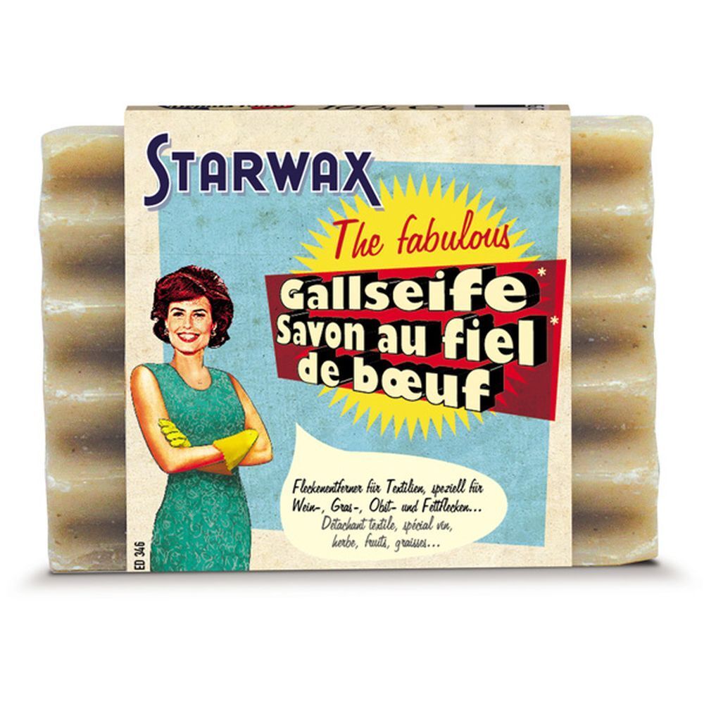 STARWAX Ochsengallenseife. Mehrere Seifenstücke mit Verpackung. Aufdruck mit Produktnamen und Frau mit gelben Handschuhen.