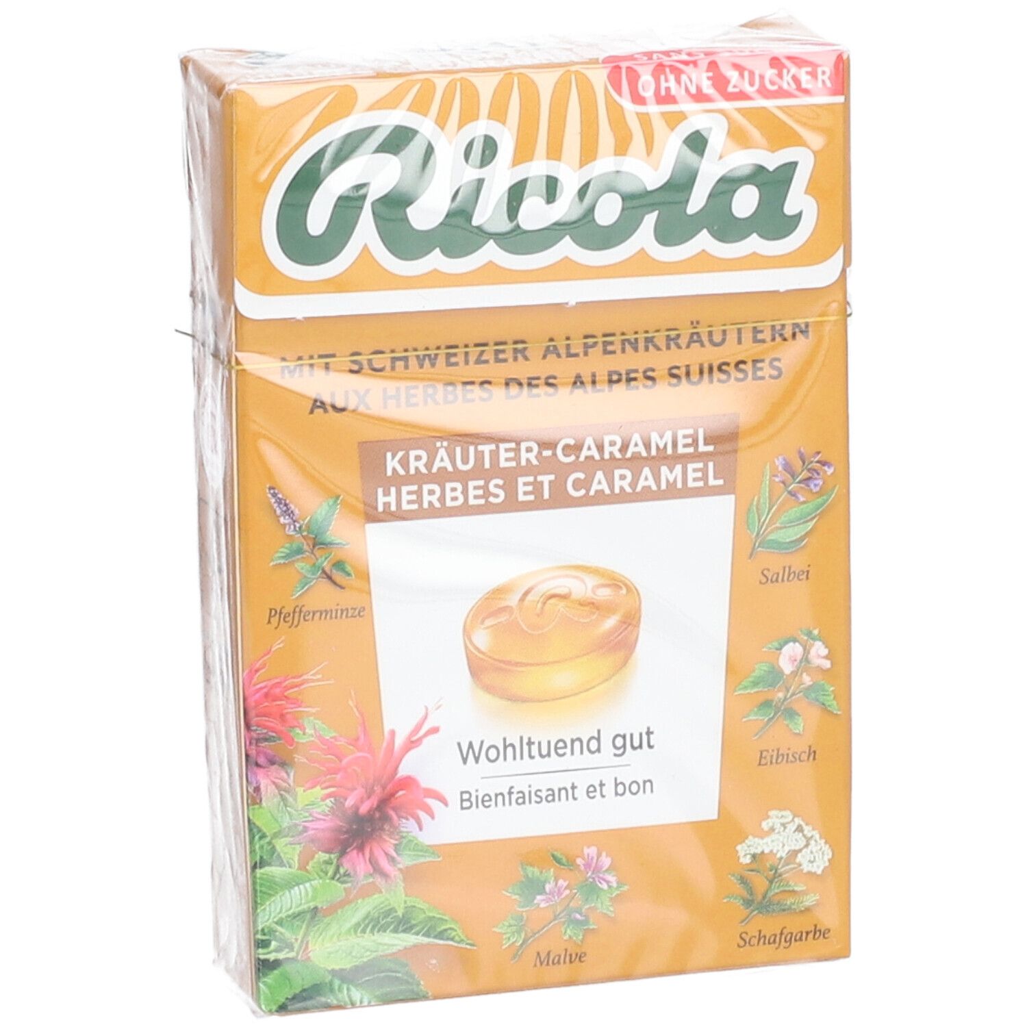 Verpackung von Ricola Kräuter- und Karamellbonbons, schräg. Vorderseite mit Produktname und Kräutern.