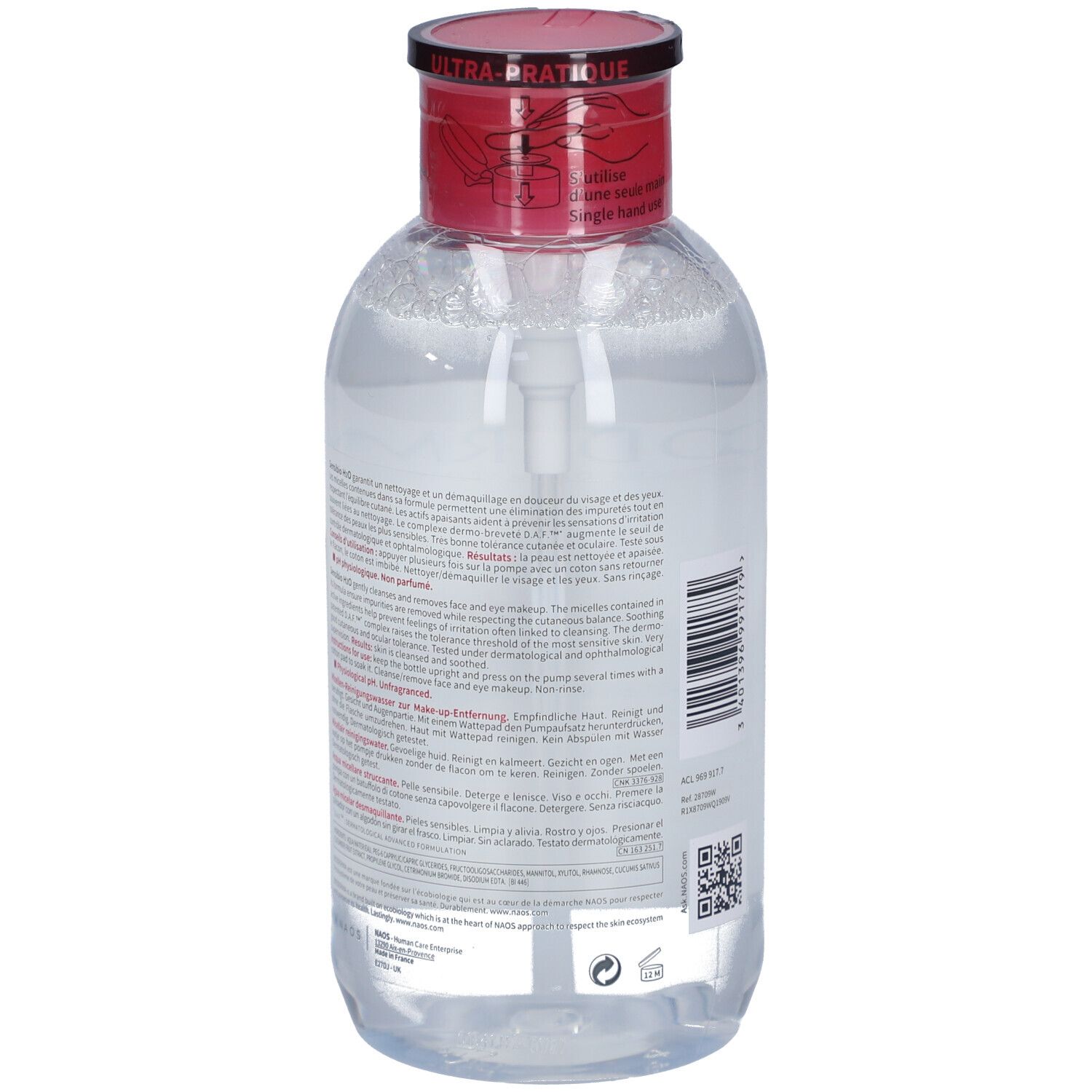 Rückansicht der Flasche mit rotem Deckel und Pumpe. Etikett mit Produktinformationen und Text in mehreren Sprachen.