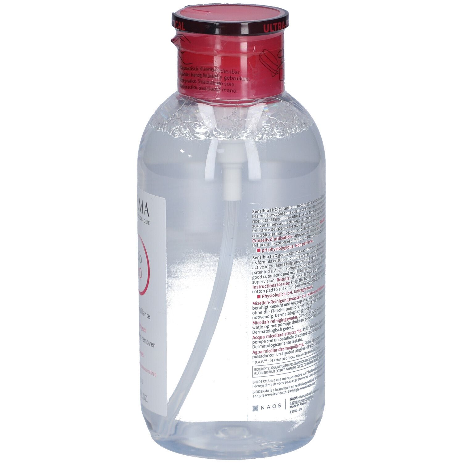 Flasche mit rotem Deckel und Pumpe. Etikett mit Produktinformationen und Text in mehreren Sprachen. Rückansicht.