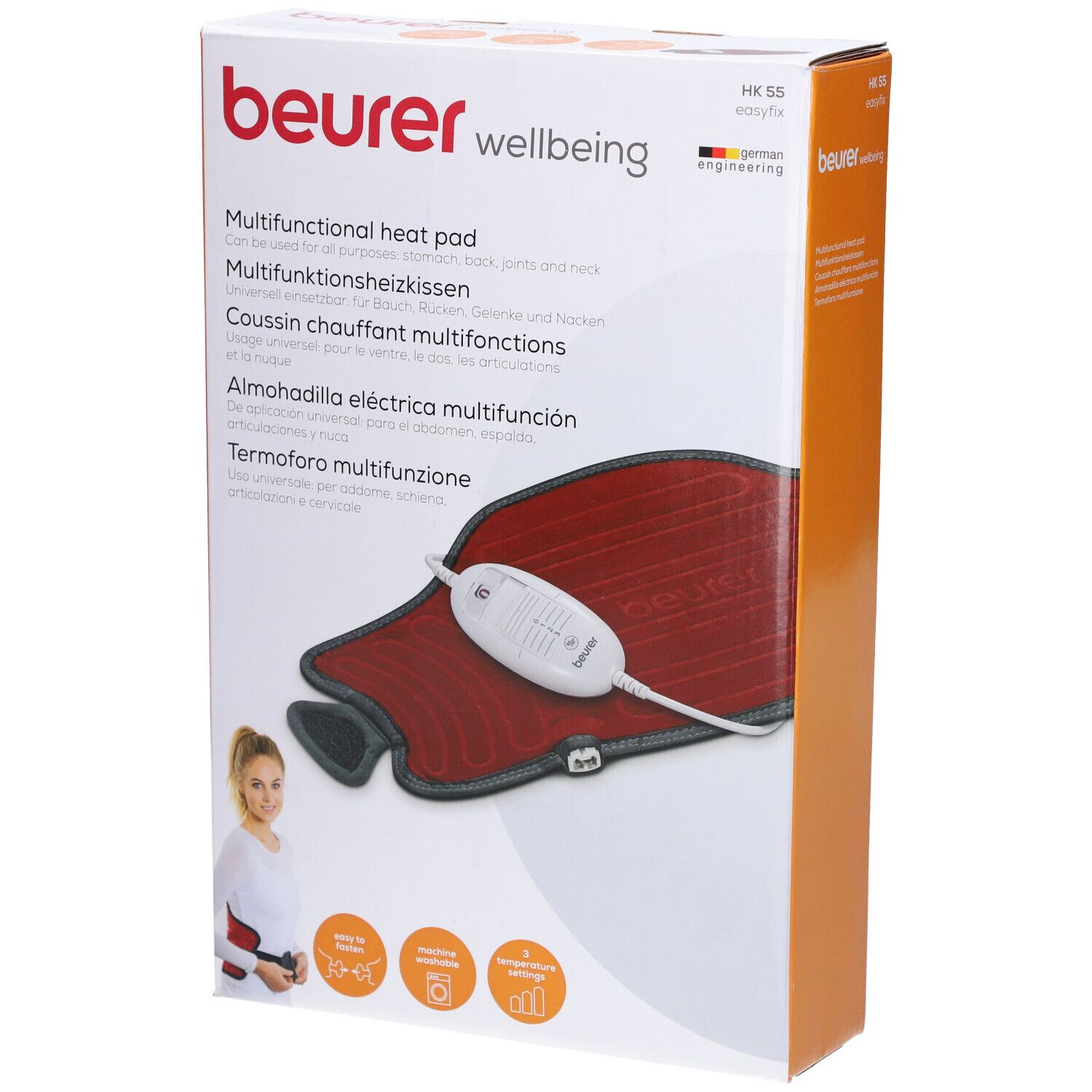 Verpackung mit Heizkissen. Rotes Kissen mit grauem Rand und weißem Bedienelement. Marke: beurer.