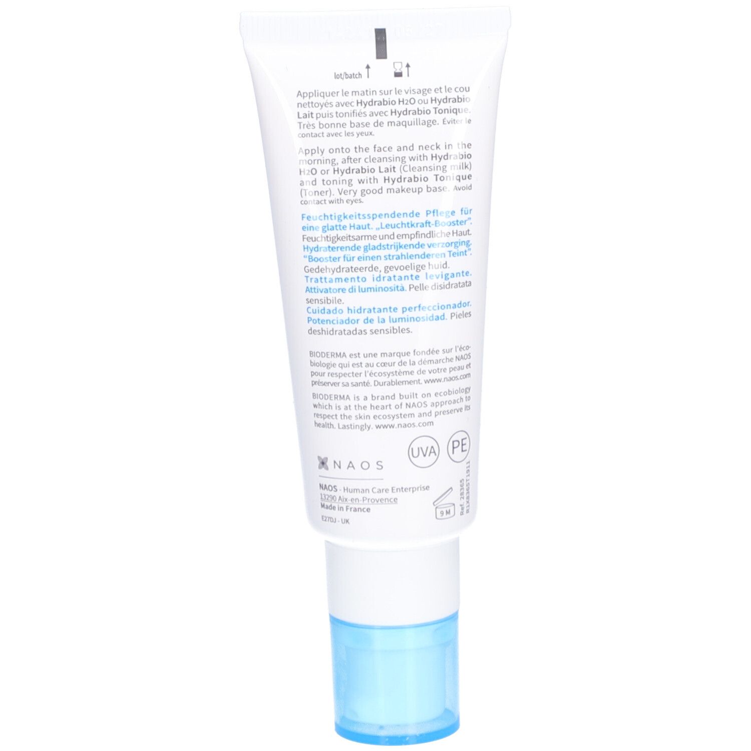 Dos d'un tube blanc avec bouchon bleu. Texte en plusieurs langues, dont le français et l'anglais.