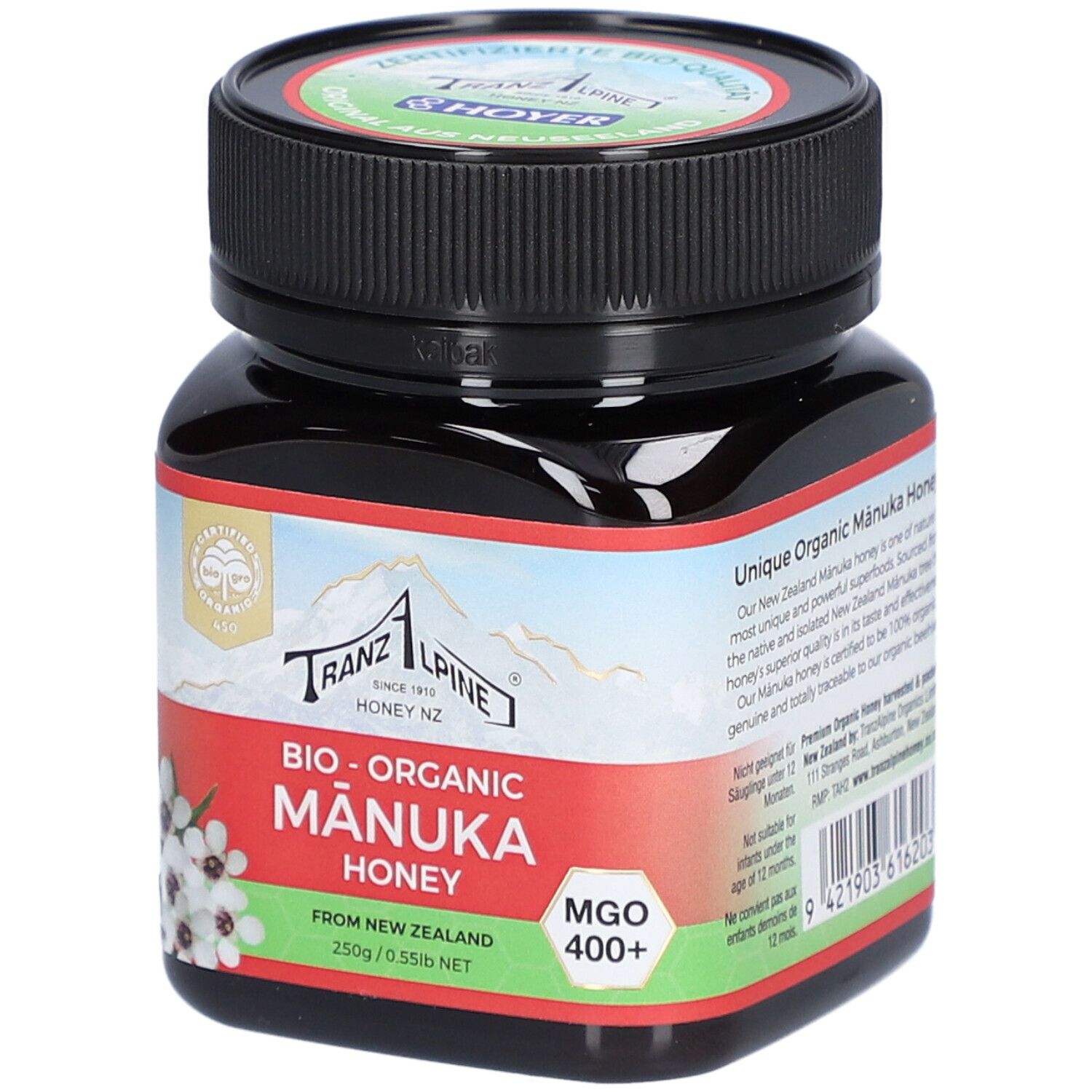 Pot en verre brun avec couvercle noir. Étiquette avec texte : Bio-Organic Manuka Honey, MGO 400+.