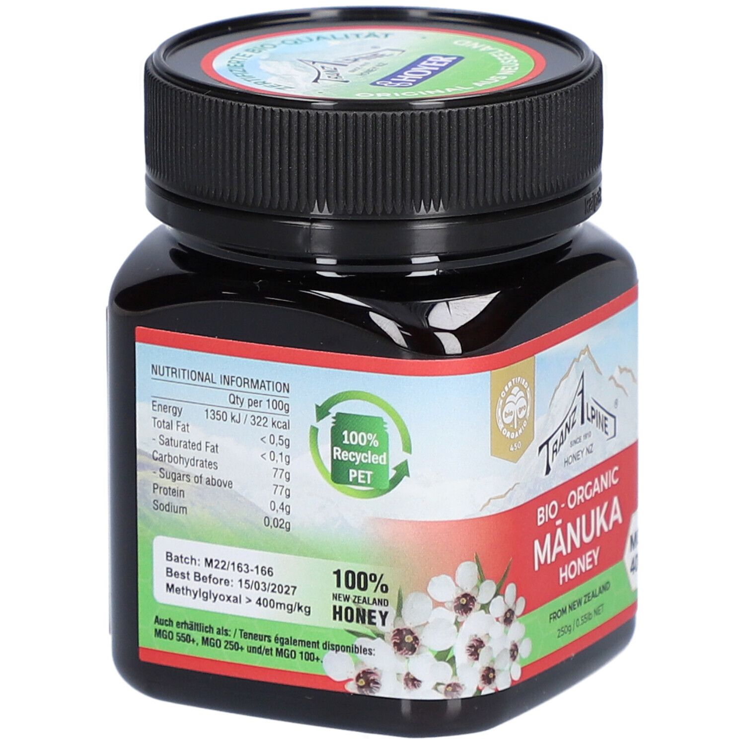 Pot en verre brun avec couvercle noir. Étiquette avec informations nutritionnelles et texte : Bio-Organic Manuka Honey.