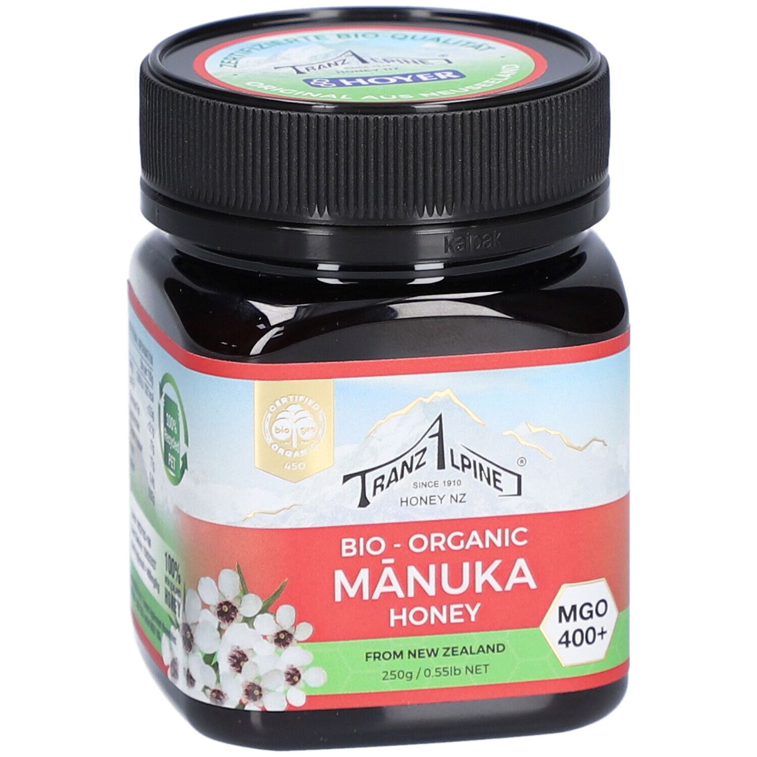 Pot en verre brun avec couvercle noir. Étiquette avec texte : Bio-Organic Manuka Honey, MGO 400+.