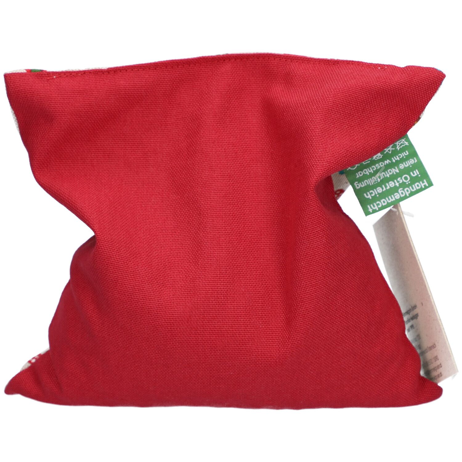 Rotes Kirschkernkissen, gefaltet. Quadratische Form. Grünes Etikett mit Text. Weißes Etikett.
