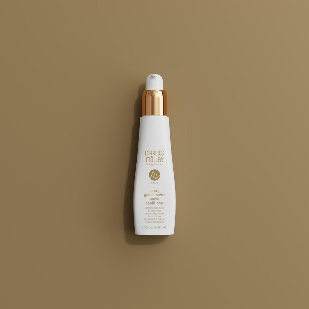 Weiße Flasche mit goldenem Verschluss. Aufschrift: Marlies Möller, Luxury Golden Caviar Mask Conditioner.