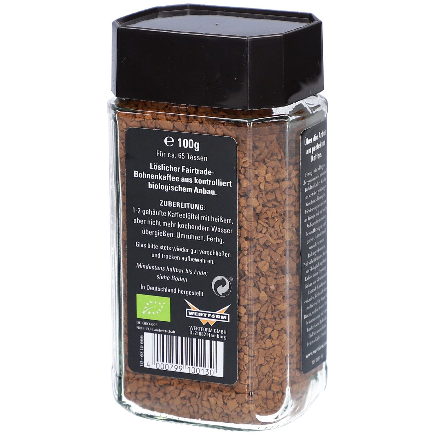 Glas mit Instant Kaffee. Aufschrift: 100g. Zubereitungshinweise. Fairtrade-Siegel und Naturland-Siegel.