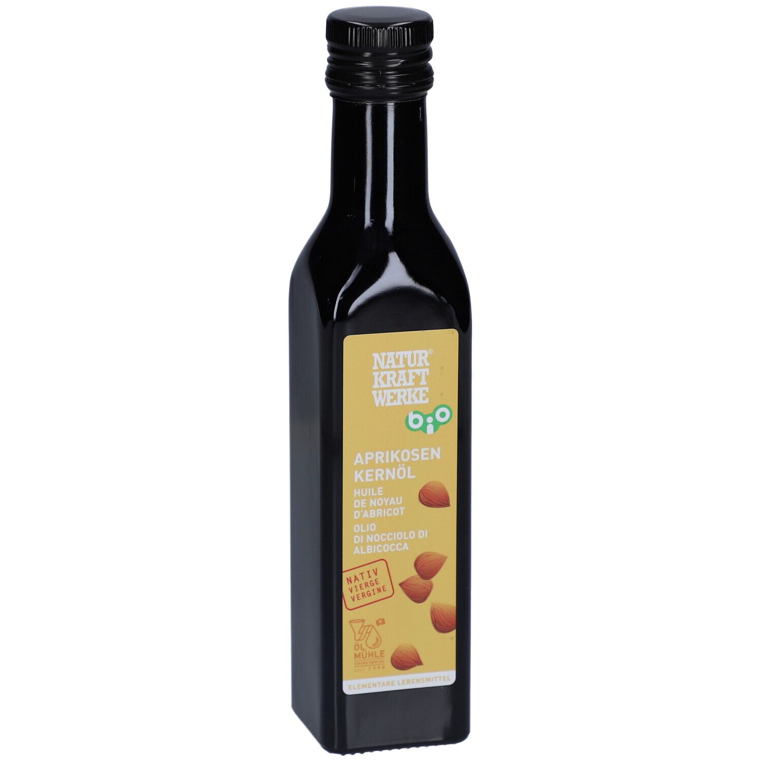 Braune Glasflasche mit schwarzem Deckel. Etikett mit Produktnamen, Bio-Siegel und Aprikosenkernen. Nahaufnahme.