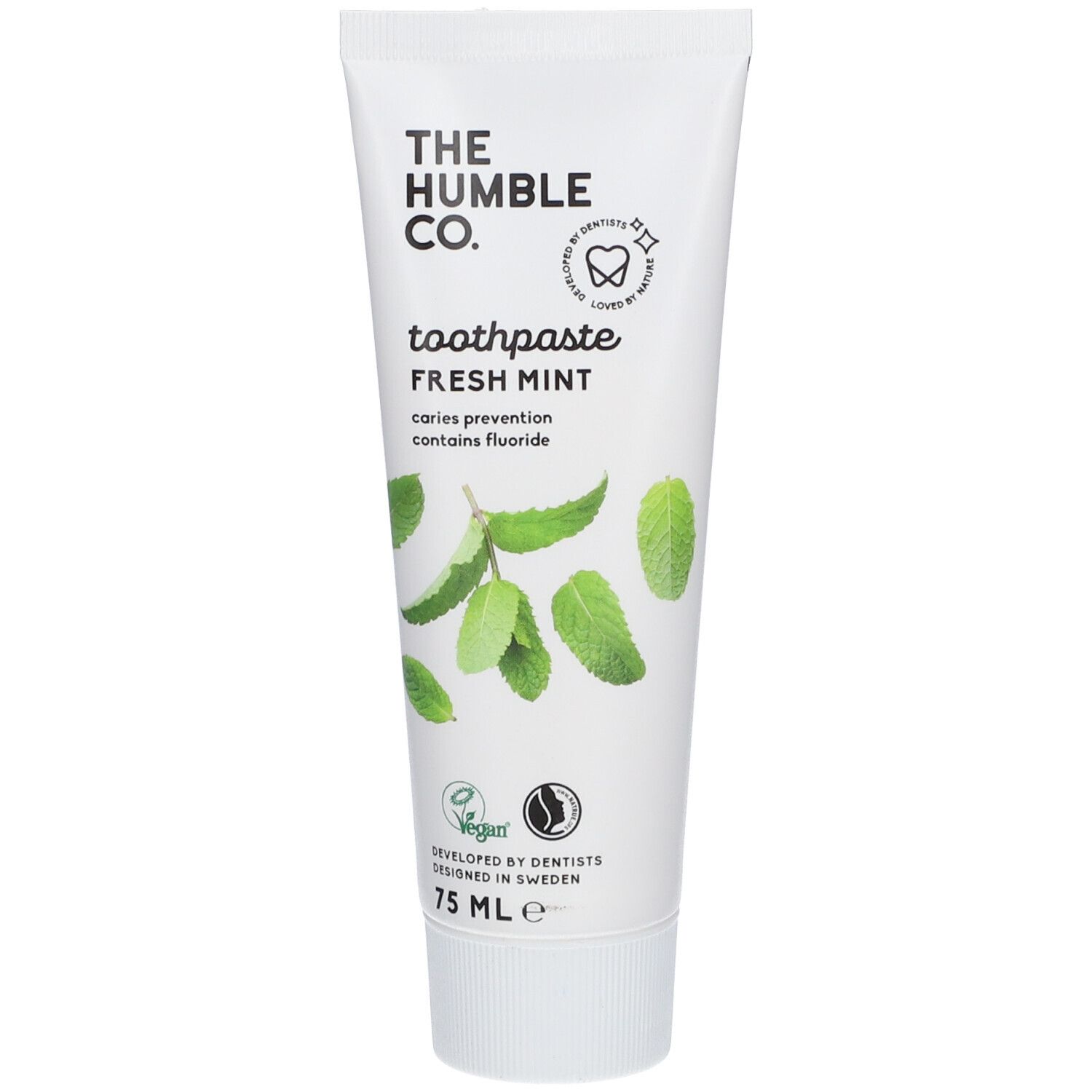 Zahnpasta-Tube, weiß, mit grünem Aufdruck. Enthält Minzblätter und Text: "THE HUMBLE CO.", "Fresh Mint".