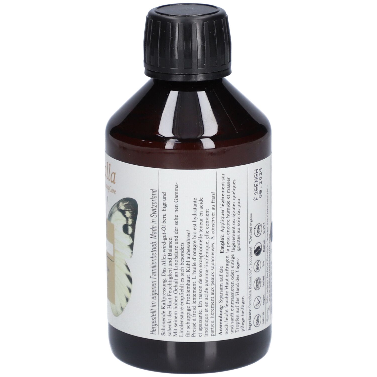 Flacon en verre brun avec bouchon noir. Étiquette avec texte, papillon, Nachtkerze Bio-Pflege, Beruhigend, Organic evening primrose oil.