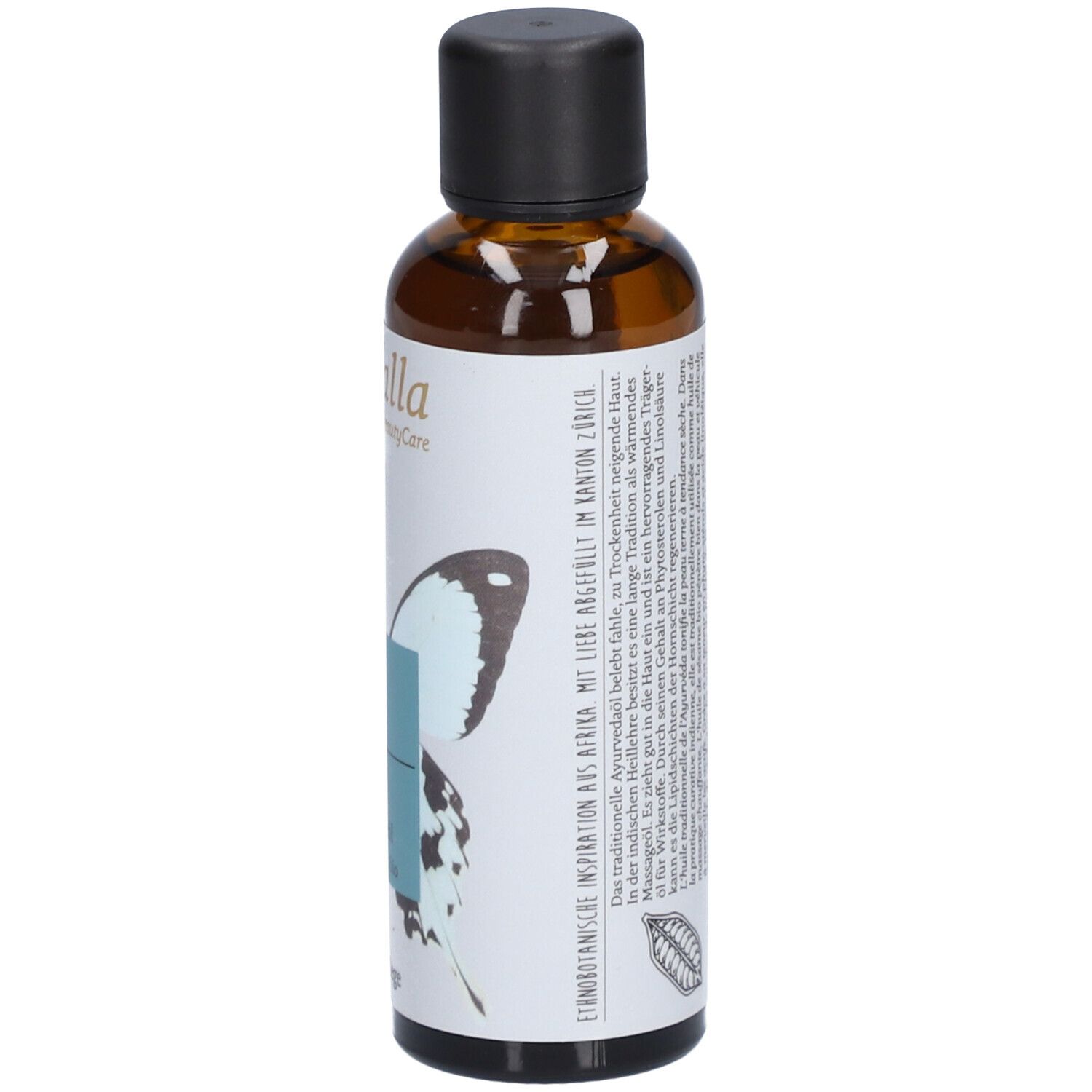 Braune Glasflasche mit schwarzem Deckel. Etikett mit Text und Logo. Inspiration aus Ayurveda. Hergestellt in der Schweiz.