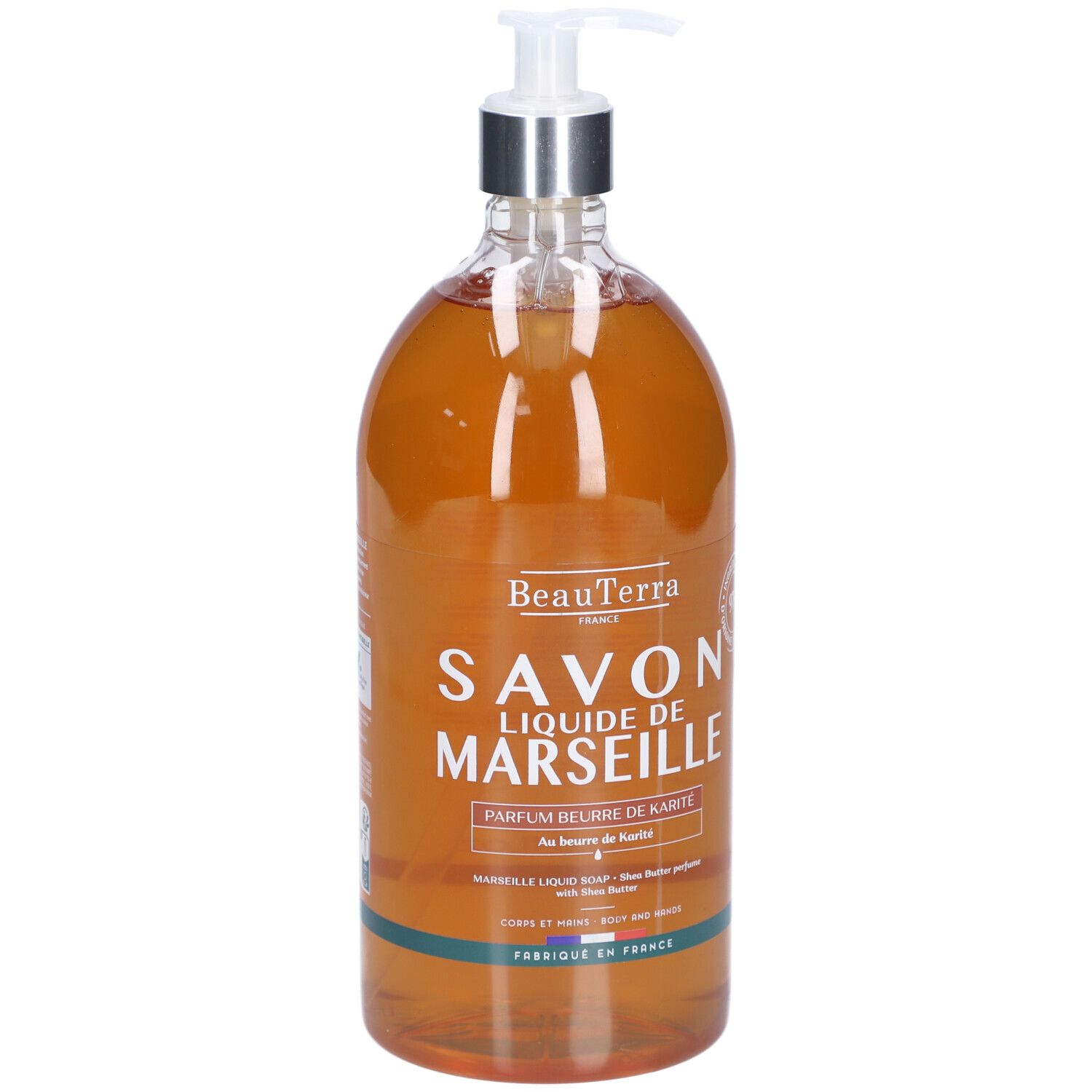 Savon liquide en flacon transparent avec pompe. Inscription: Savon Liquide de Marseille, Parfum beurre de Karité.